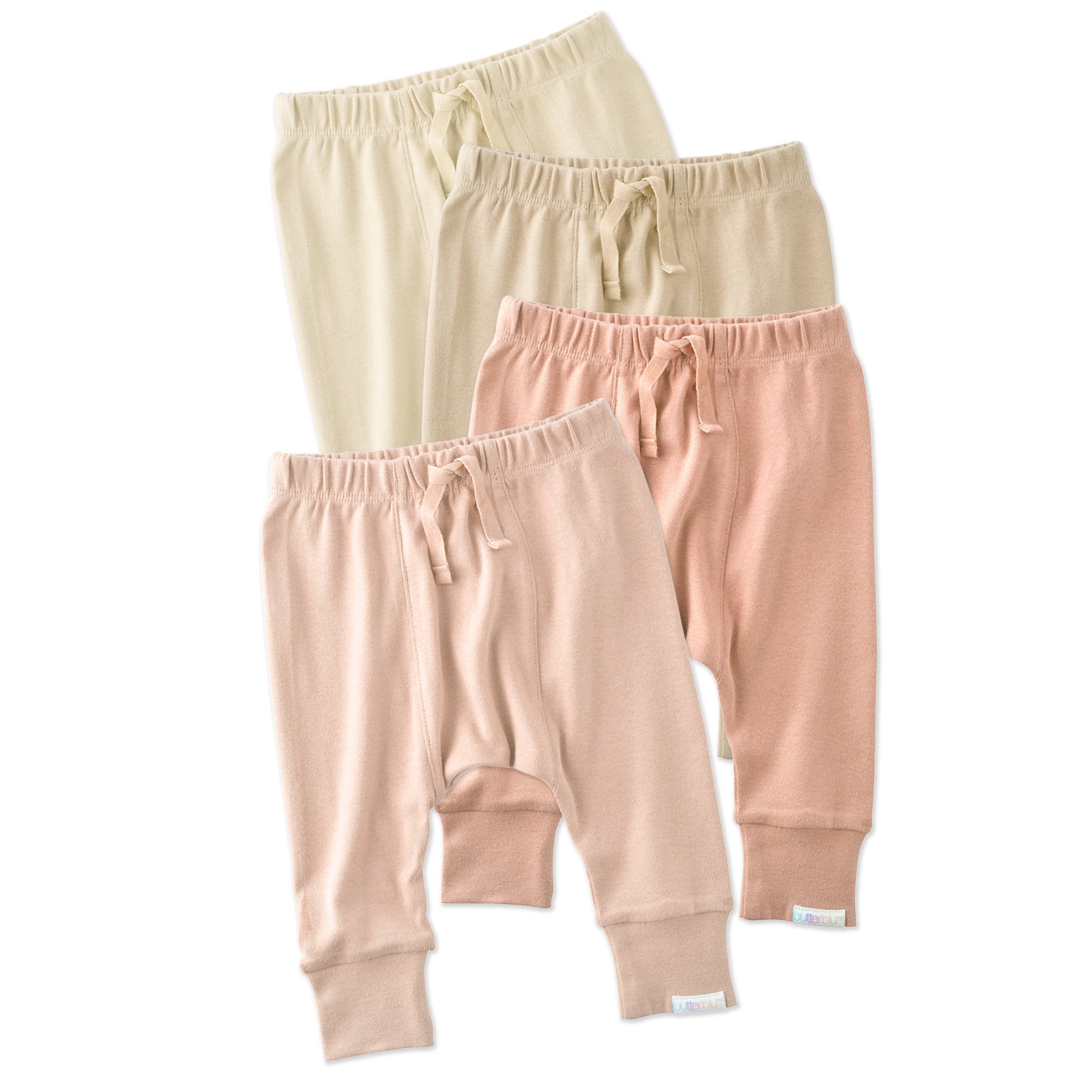 Four pairs of baby pants in beige, pink, and light pink on a white background