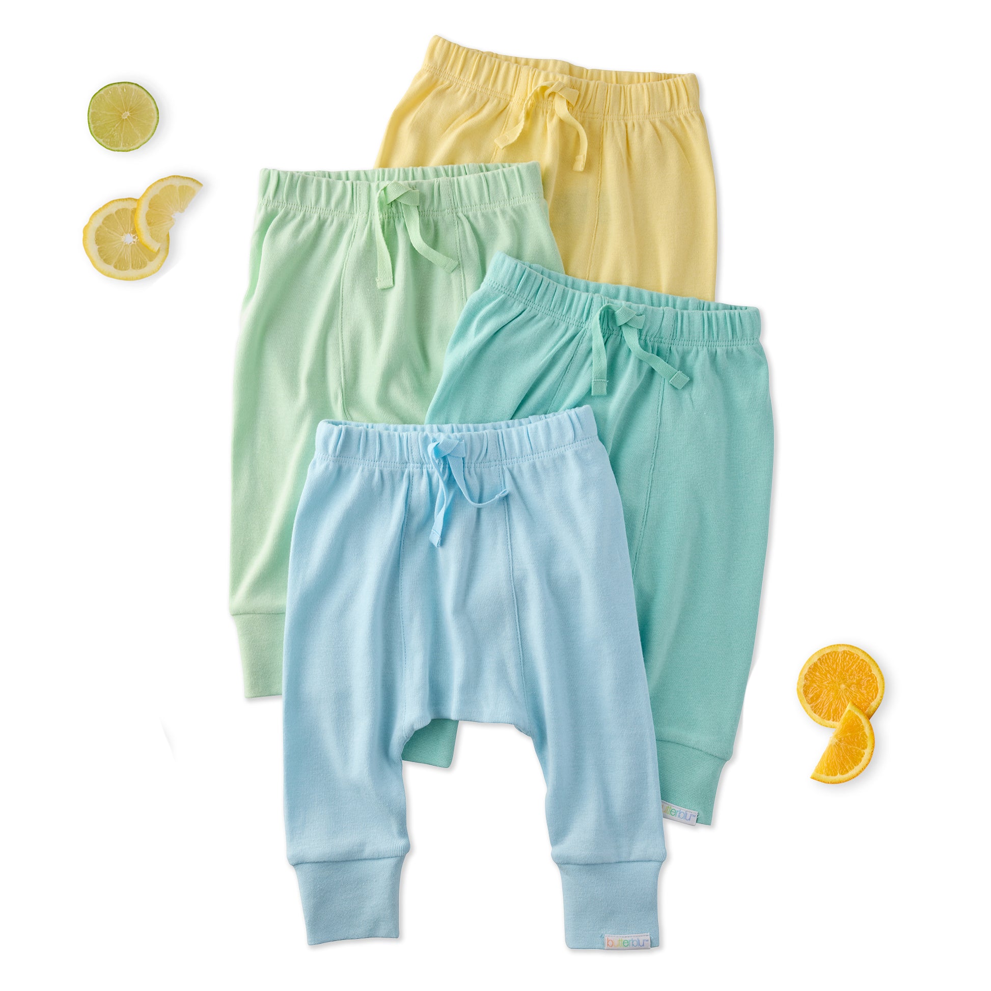 Three pairs of colorful baby pants on a white background