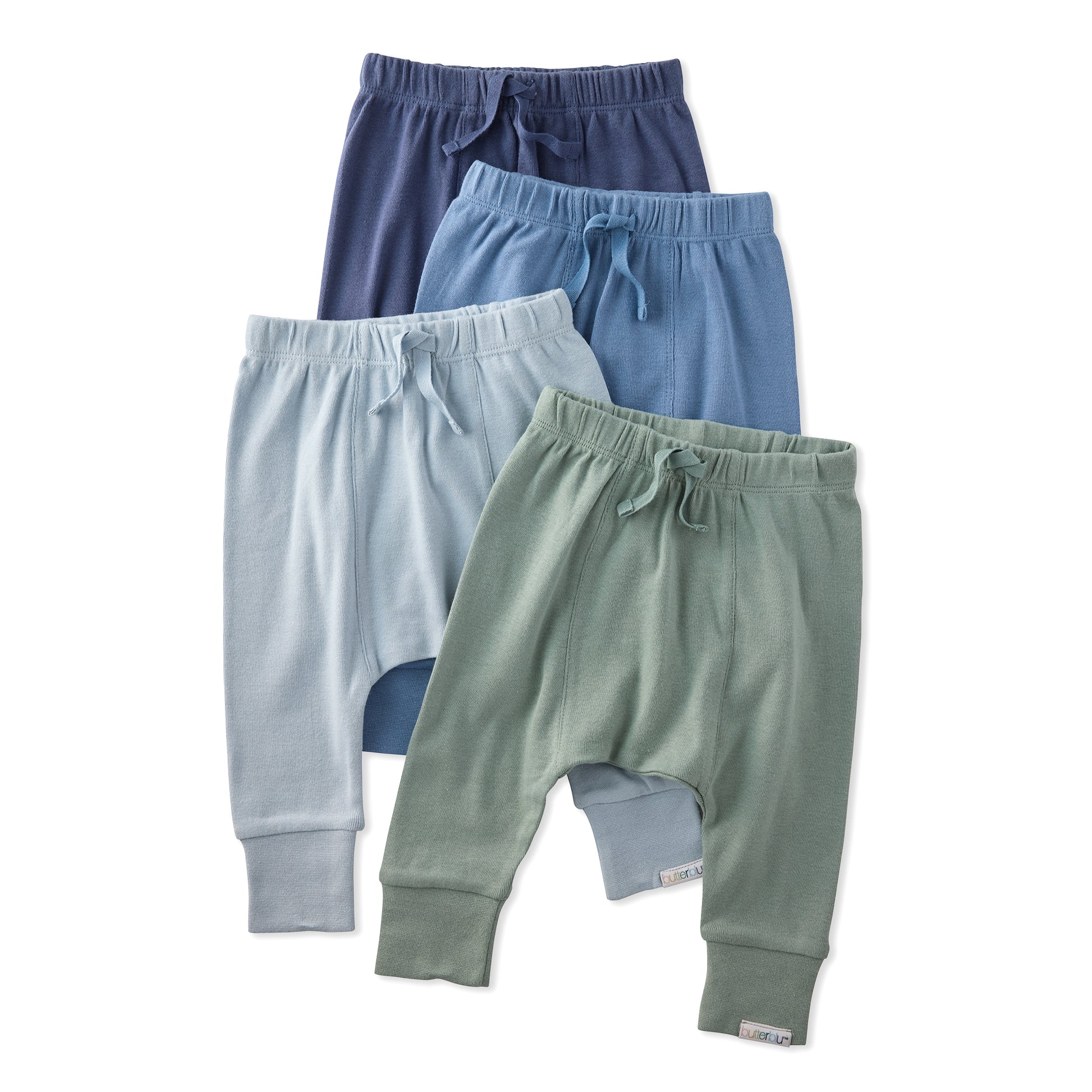 Four pairs of children's pants in different colors on a white background
