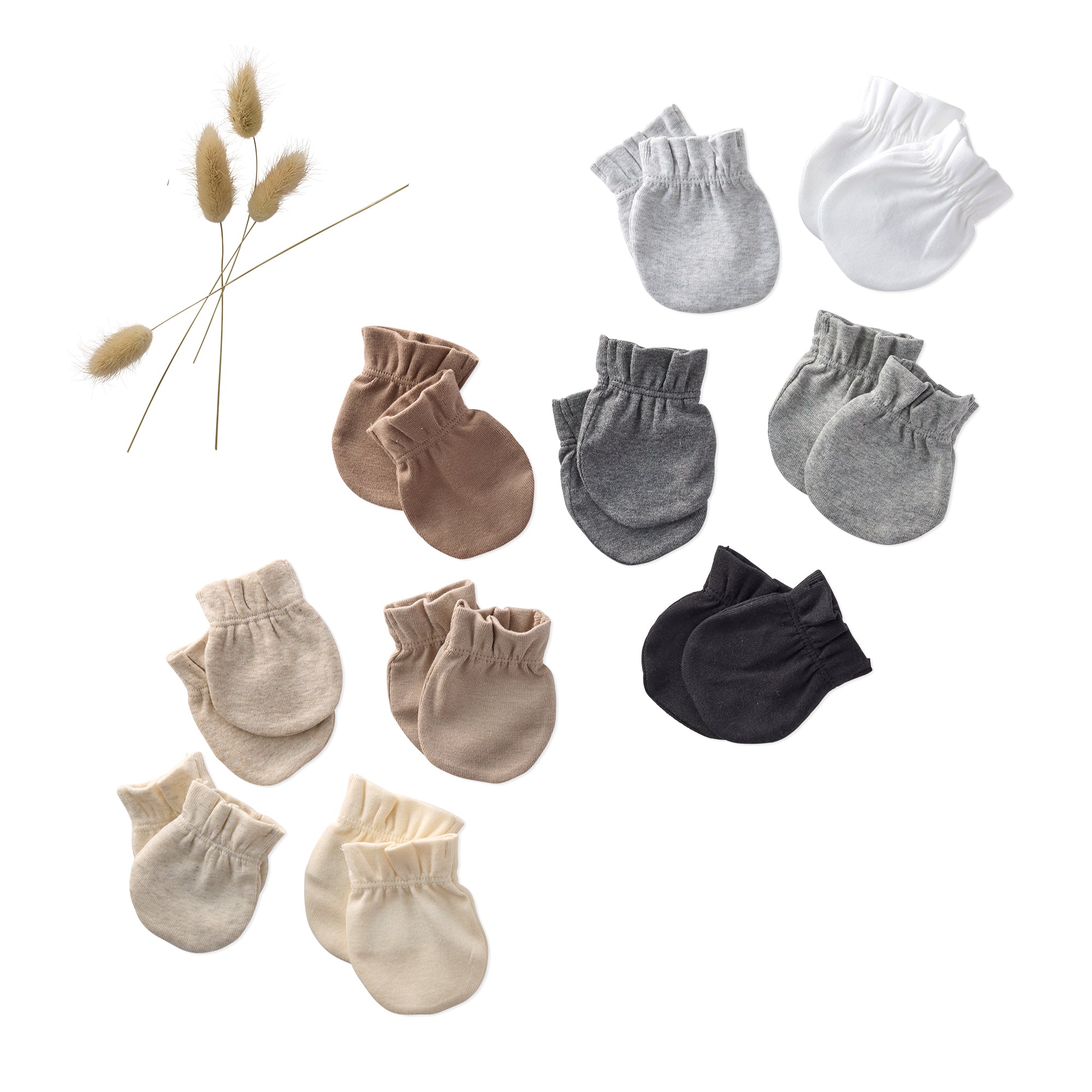Set of baby mittens in various colors on a white background