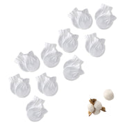 Set of white baby gloves mitts with cotton ball and cotton plant on a white background