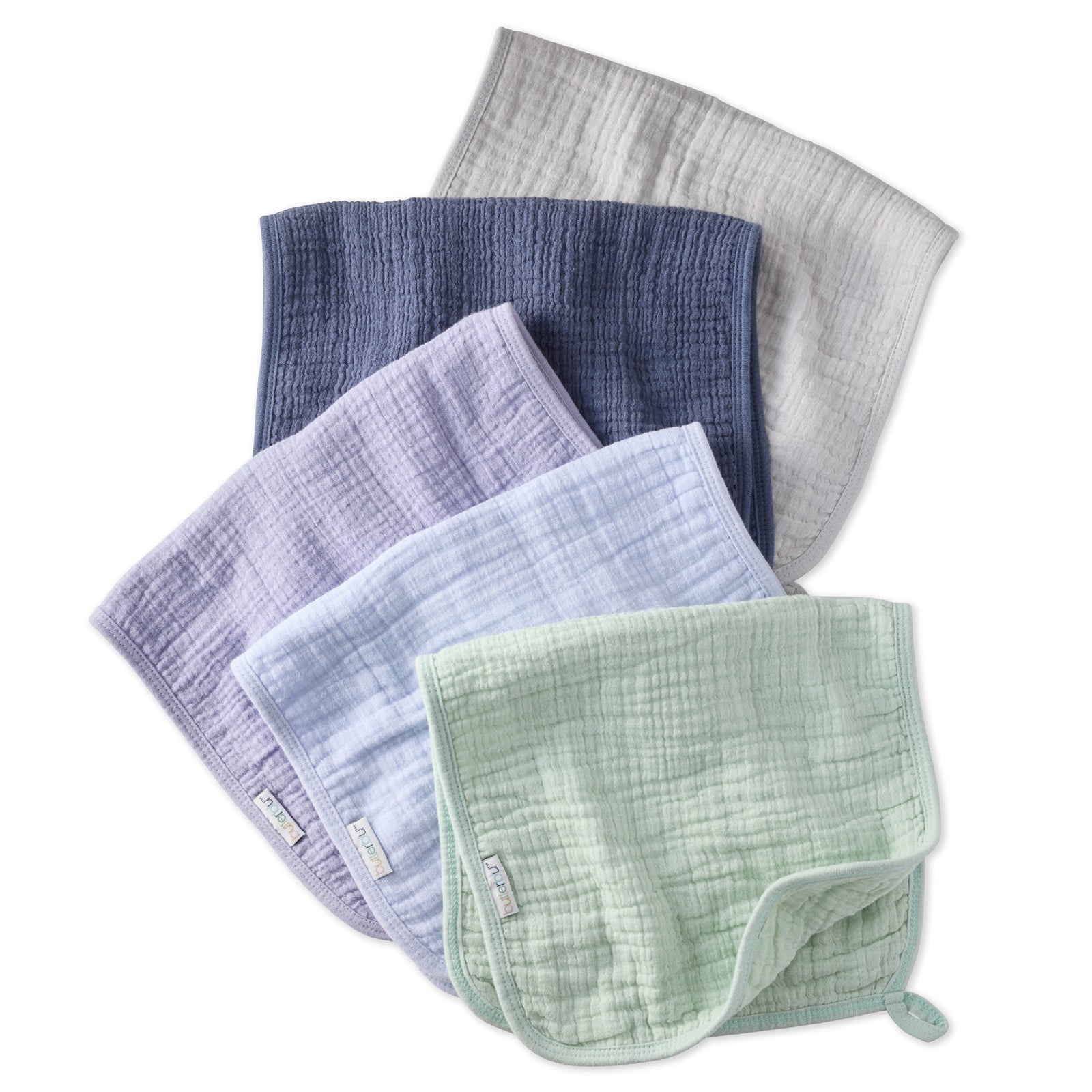 Set of five muslin burp cloths in various colors on a white background