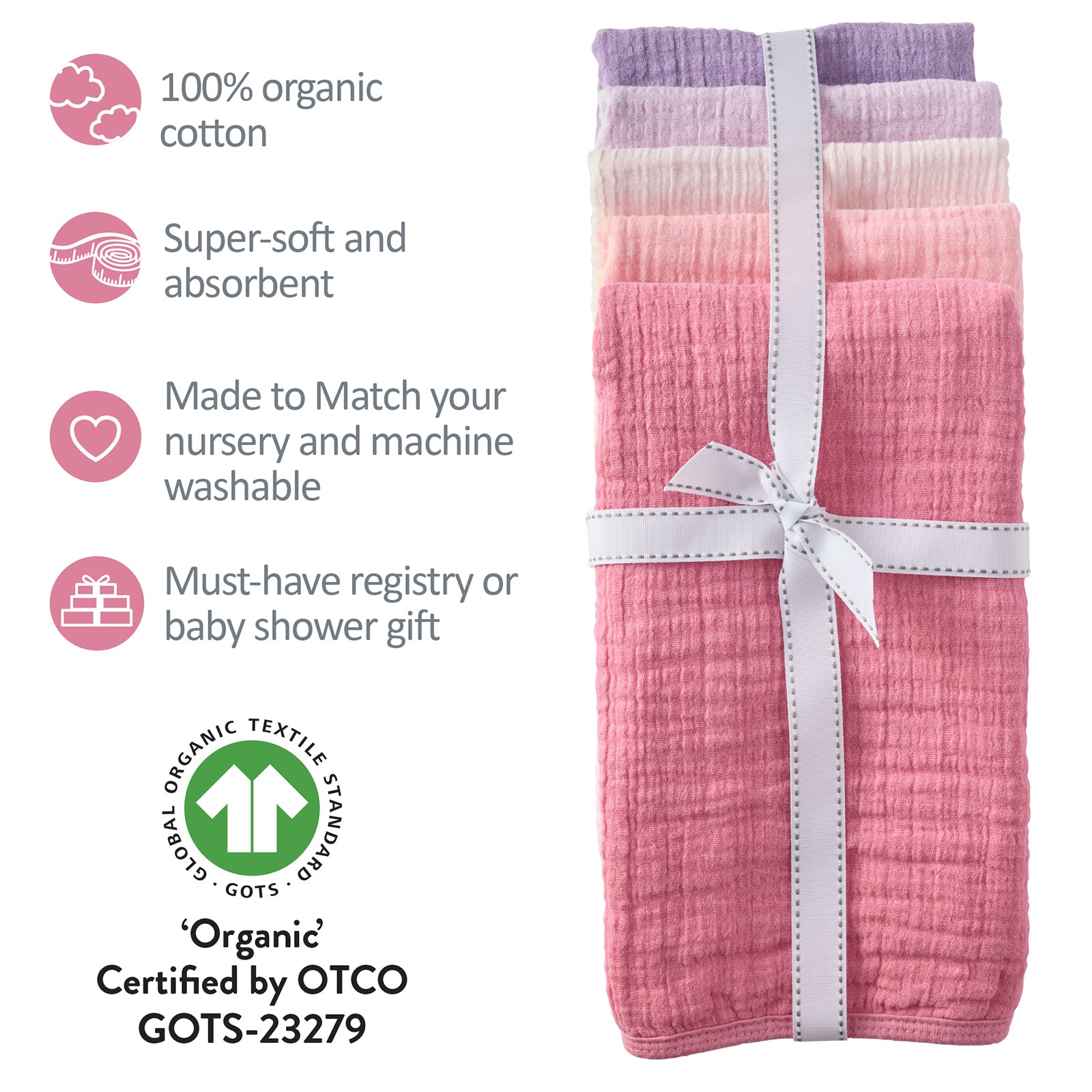 Stack of pink baby blankets with GOTS certification label on a white background