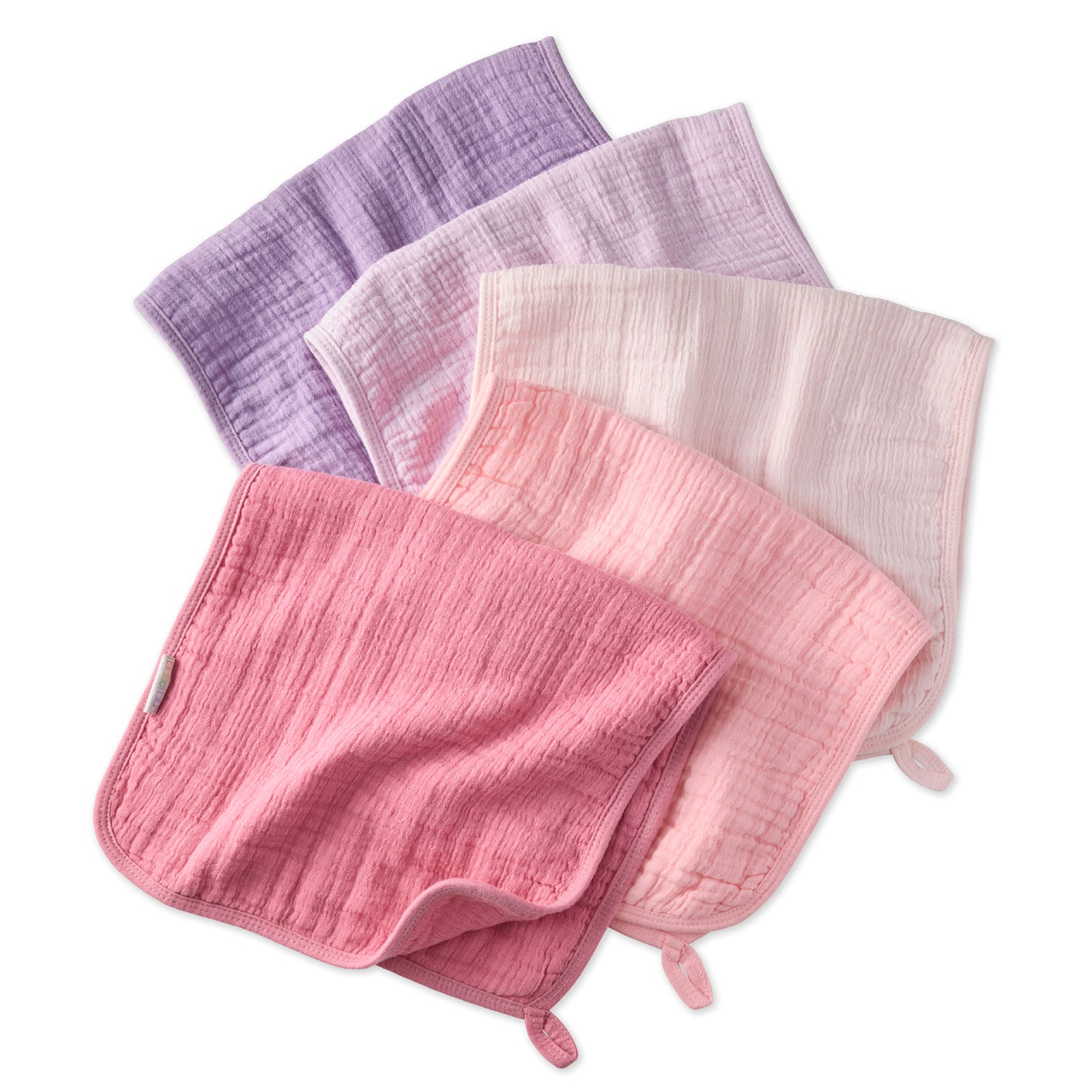 Set of four textured cloths in pink, purple, and white on a white background