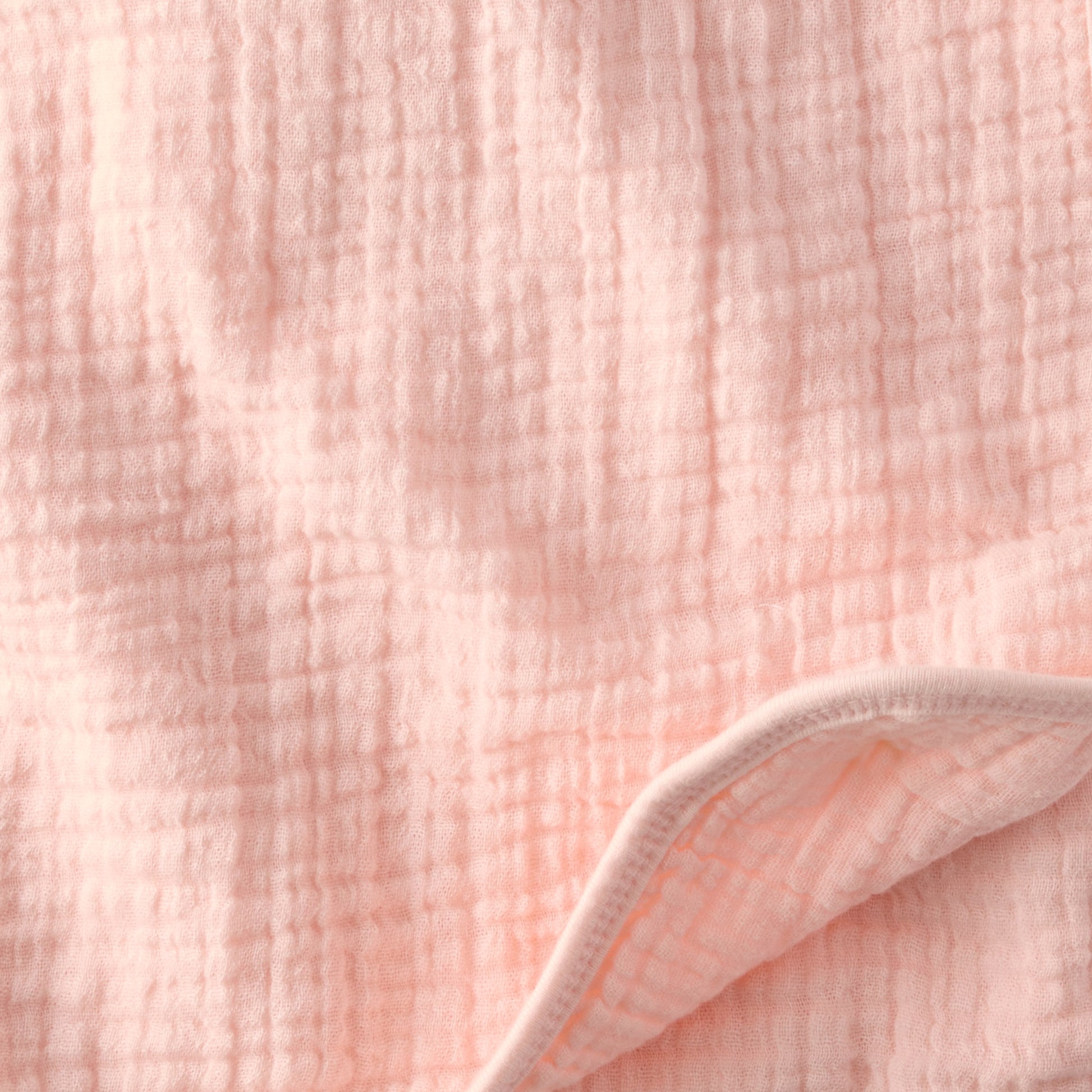 Close-up of soft pink textured fabric
