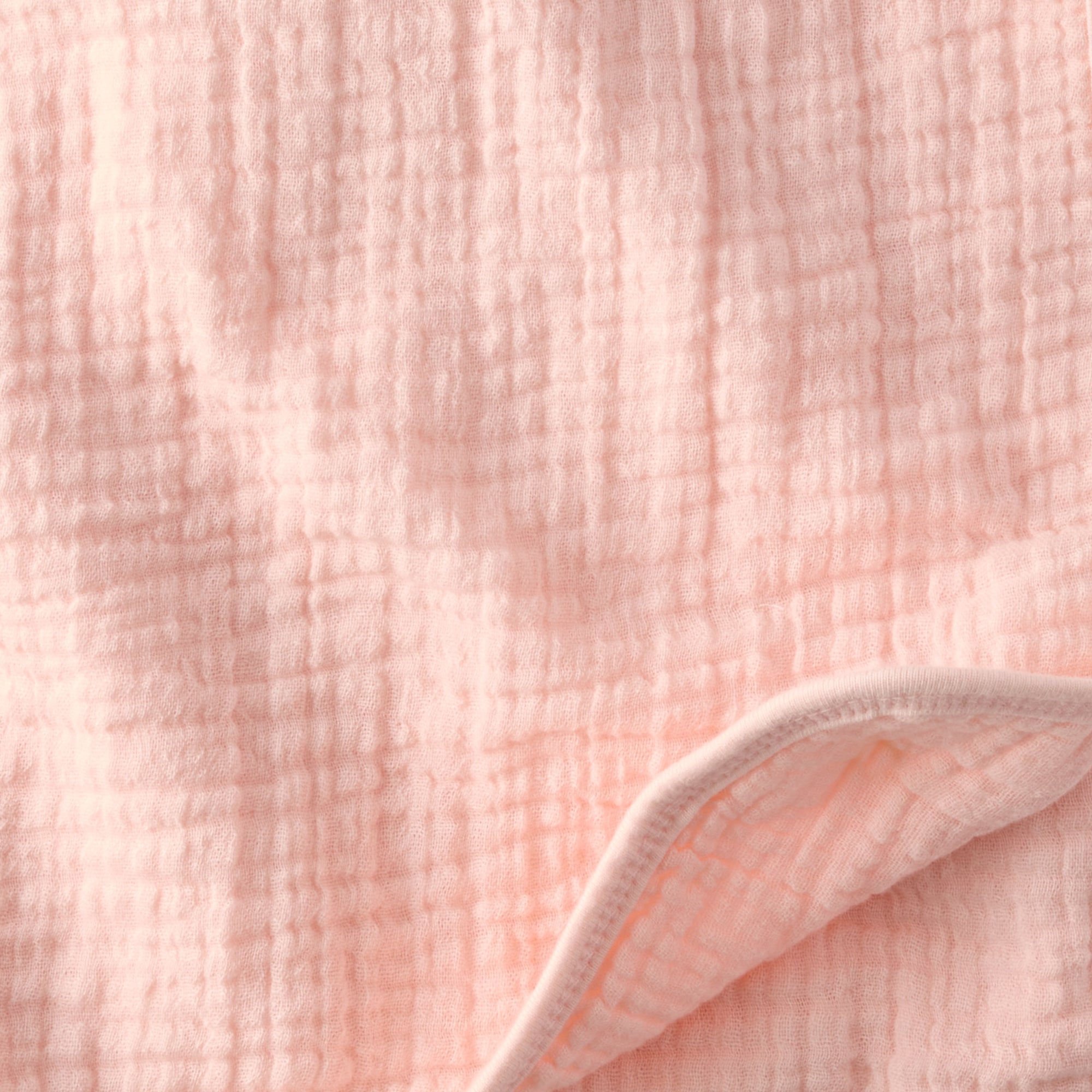 Close-up of soft pink textured fabric