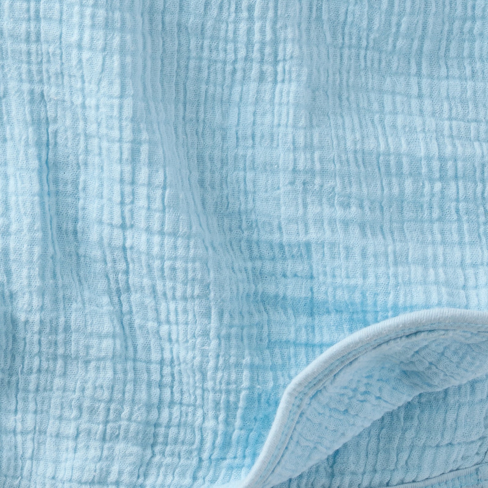 Close-up of textured light blue fabric
