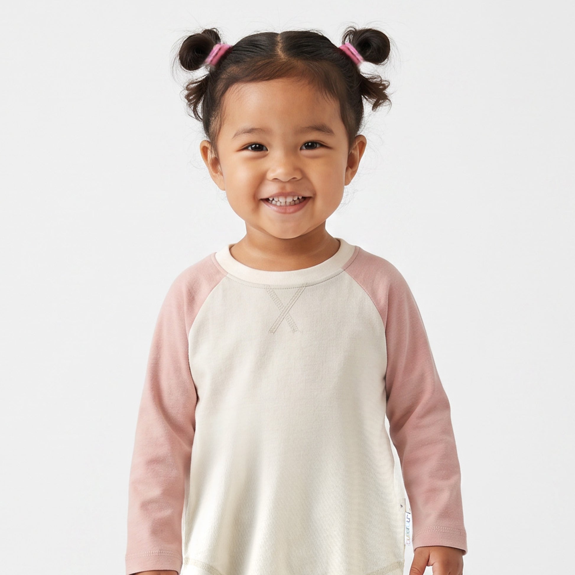 Little Girl smiling in ROOKIE baseball tee