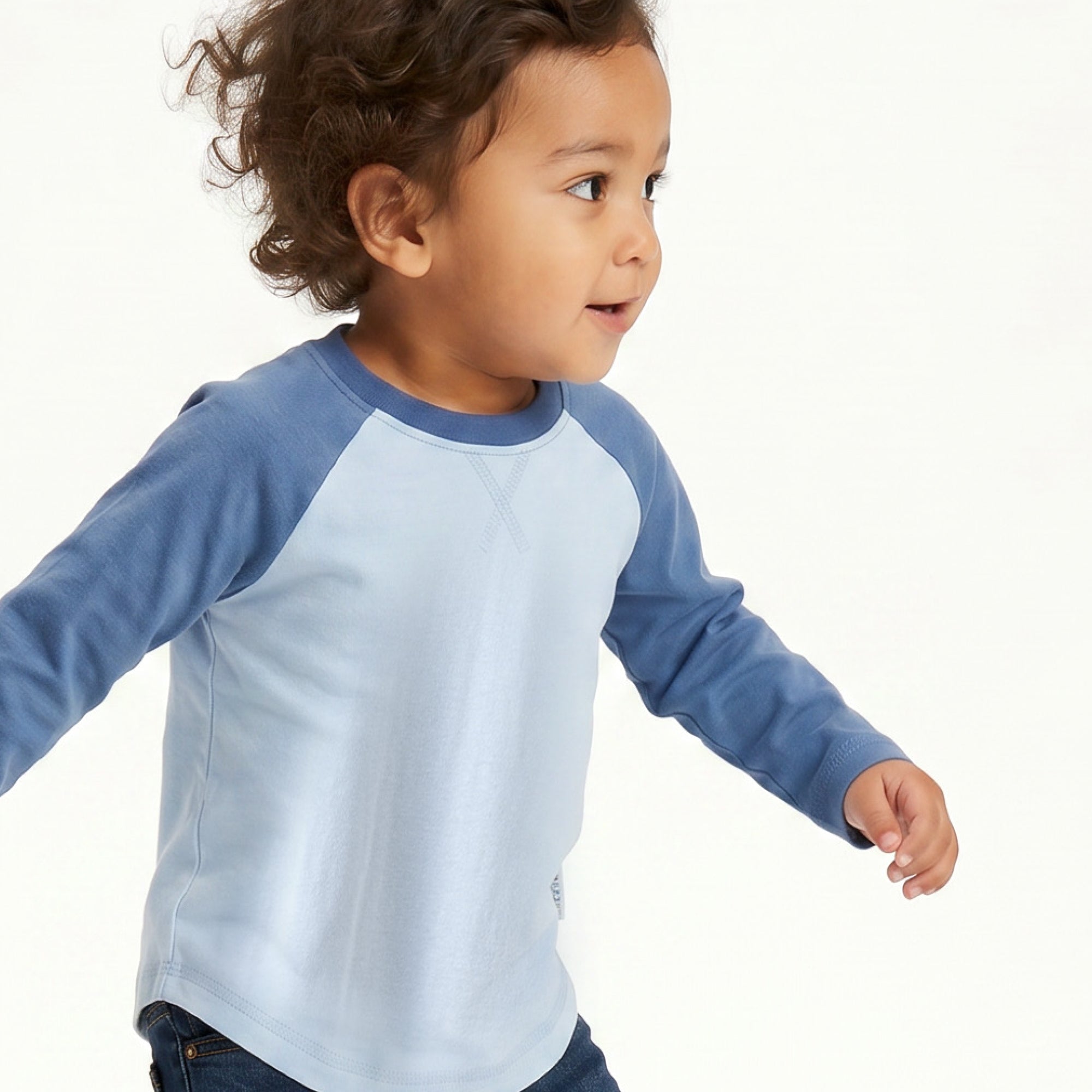 Little Girl smiling in ROOKIE baseball tee