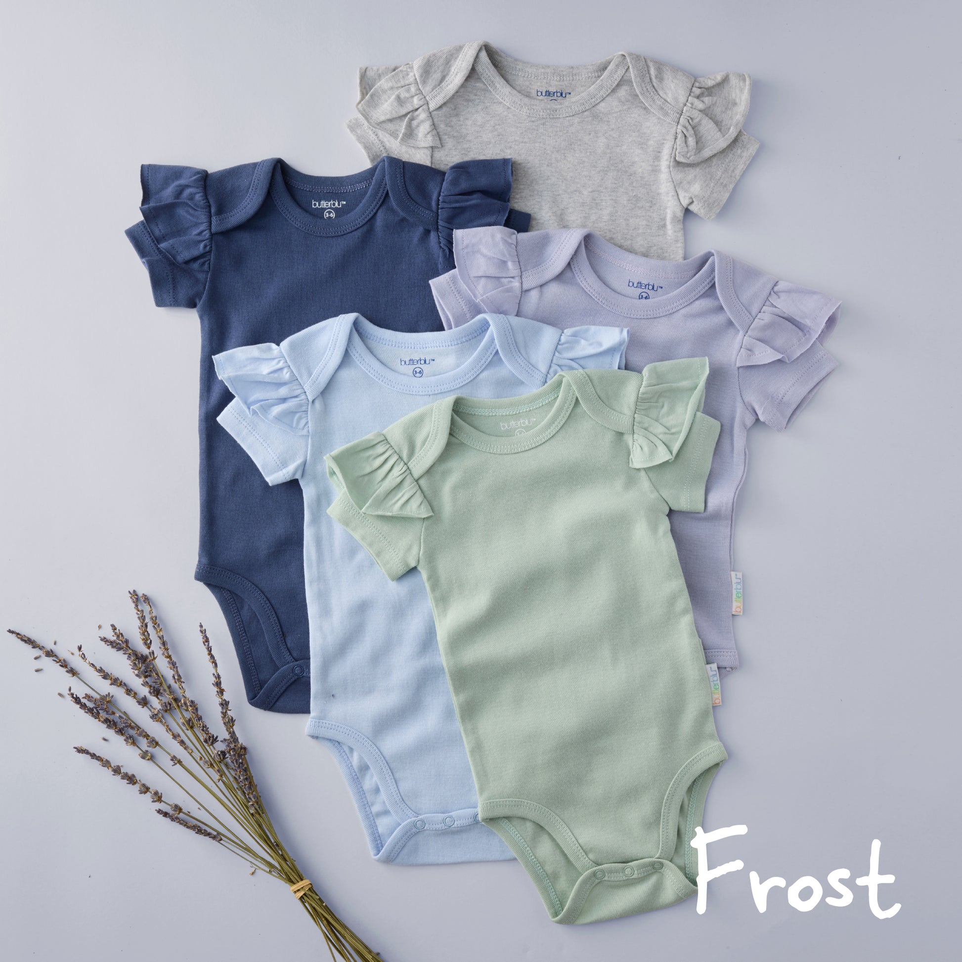Set of colorful baby bodysuits with ruffled sleeves on a light gray background.
