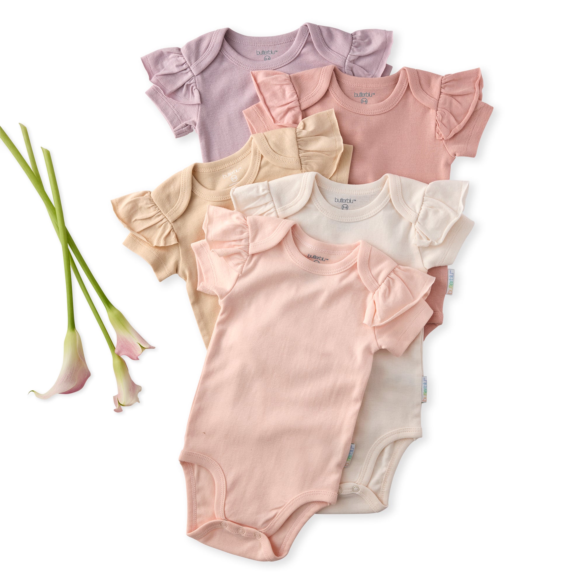 Set of five baby bodysuits in pink, beige, and light pink with ruffled shoulders on a white background.