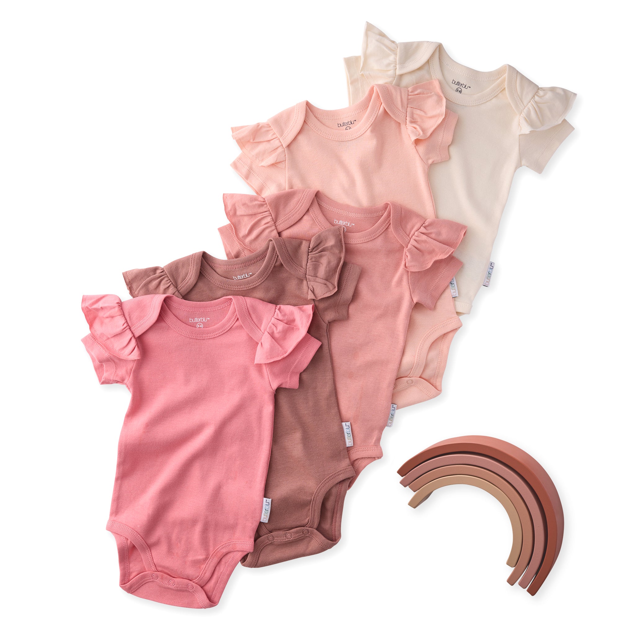 Set of baby bodysuits in various colors with a wooden rainbow toy on a white background