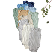 Layout of 10 short sleeve bodysuits in Seafoam Terra Rainbow on a white background with a plant detail
