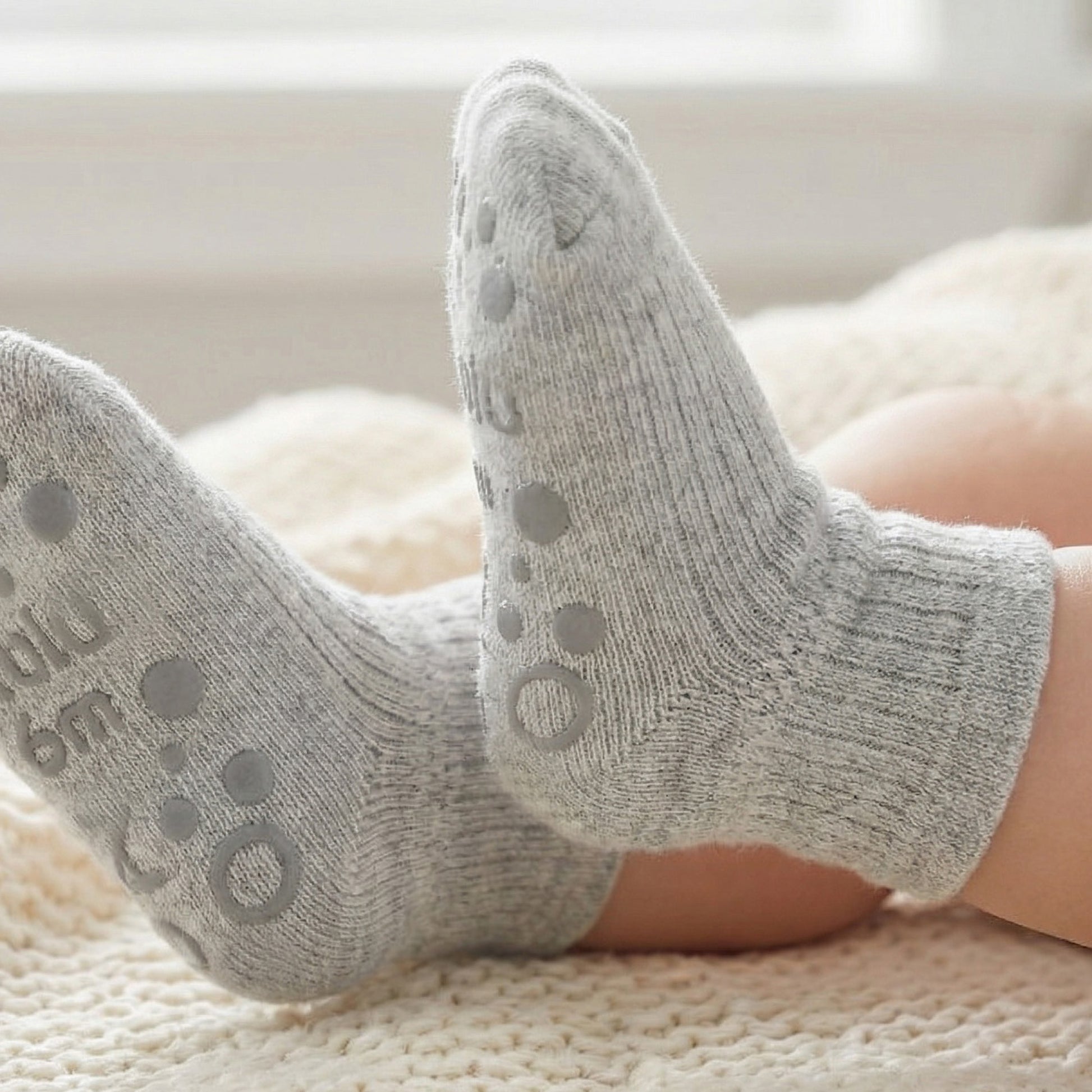 Zuri sock modeled on baby feet
