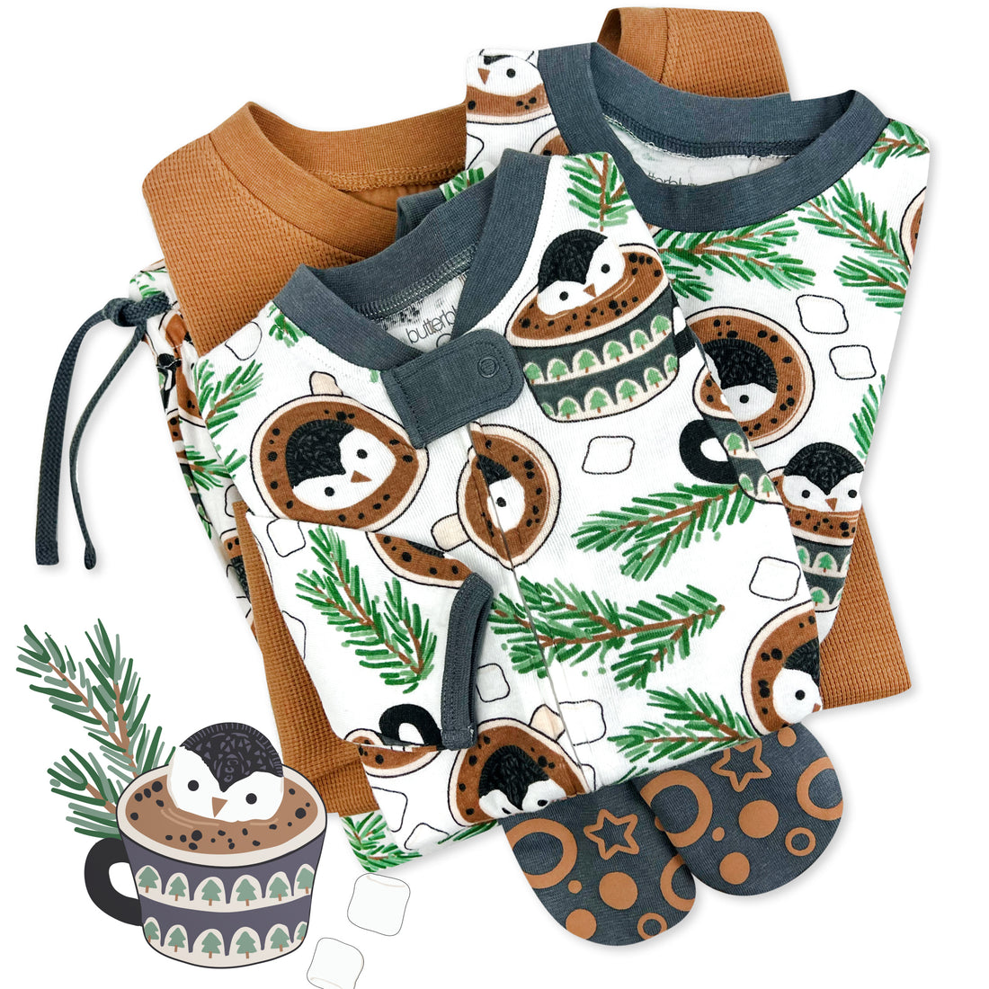 Matching family pajamas with penguin and hot chocolate design on a white background