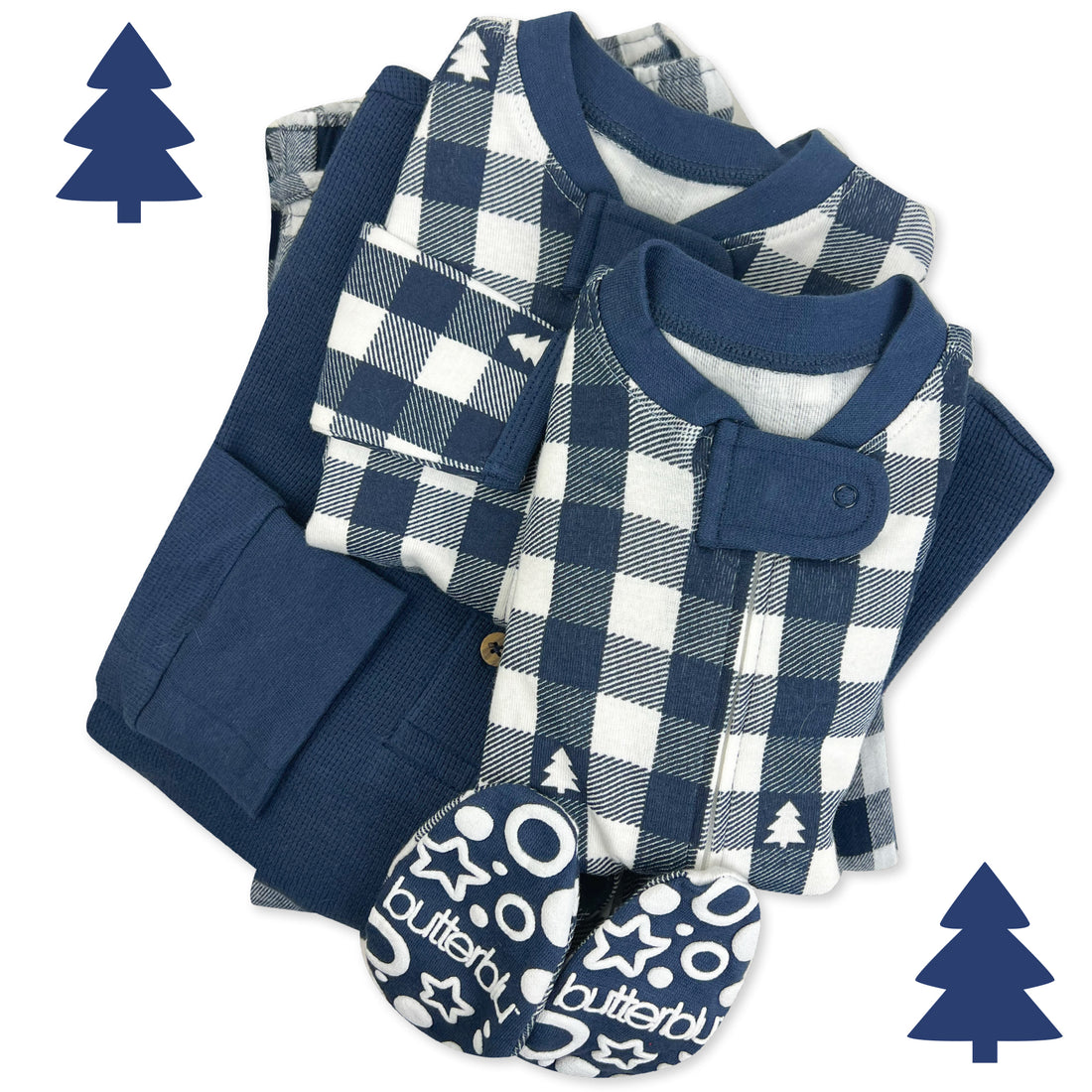 Matching family pajamas set with checkered shirt and pants, and baby booties on a white background.