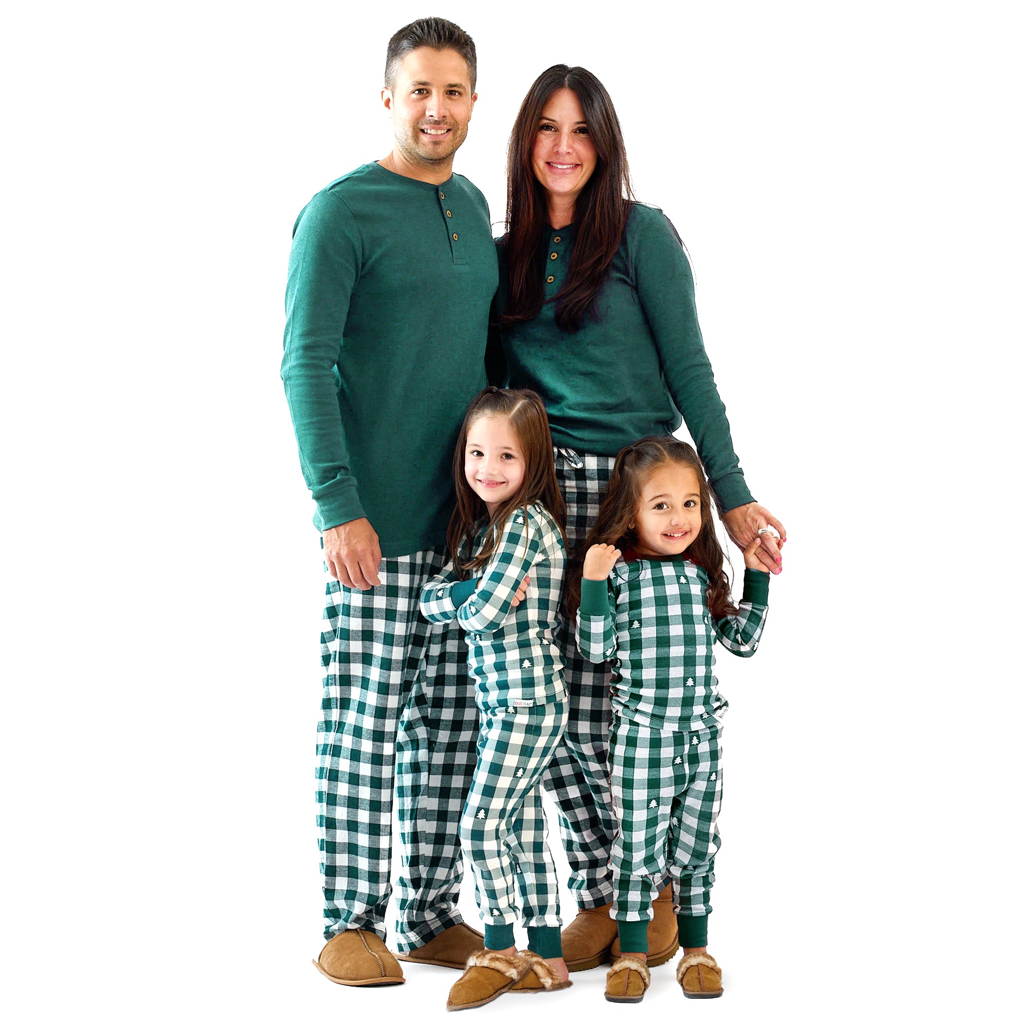 Family of four wearing matching green and white checkered pajamas on a white background