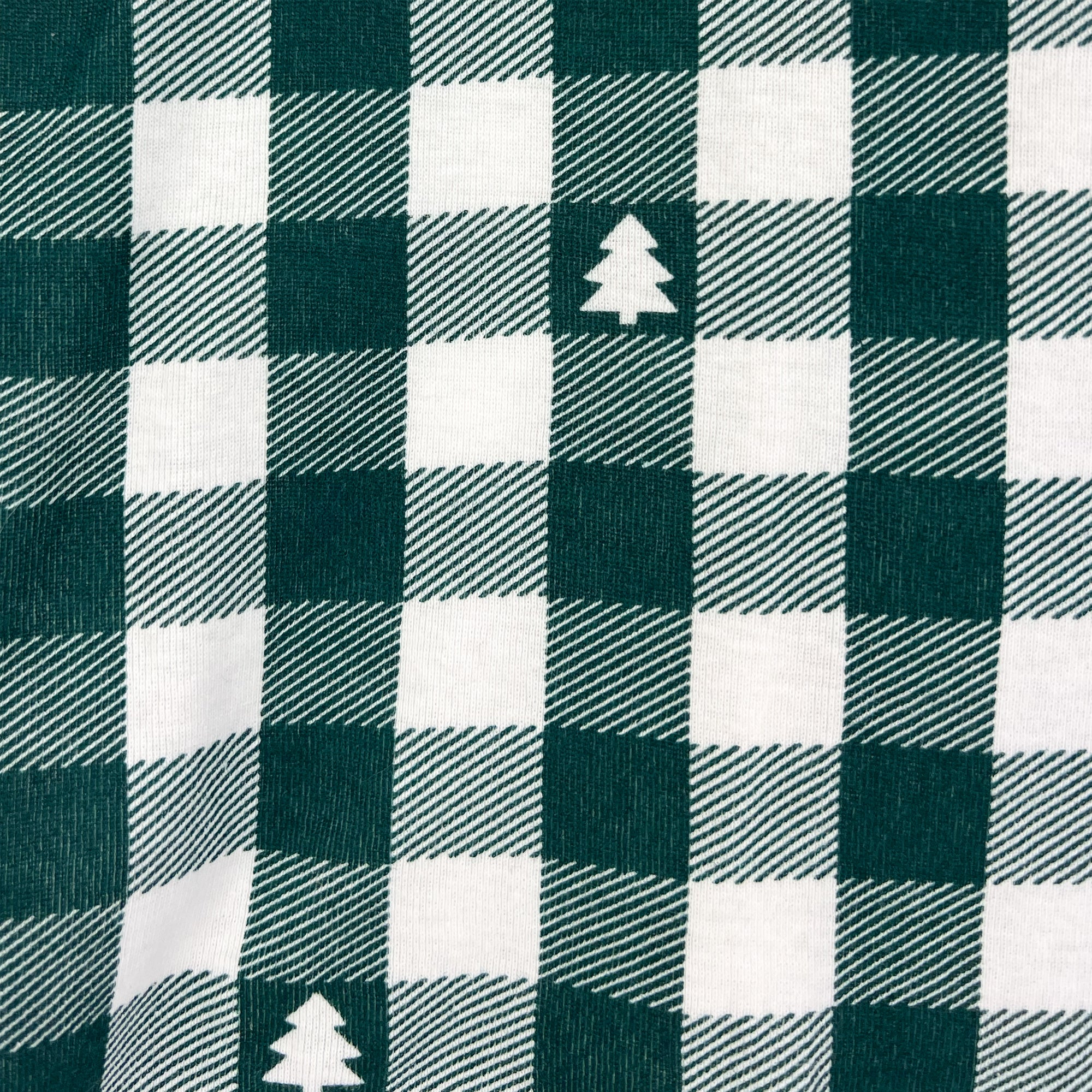 Green and white checkered fabric with tree pattern