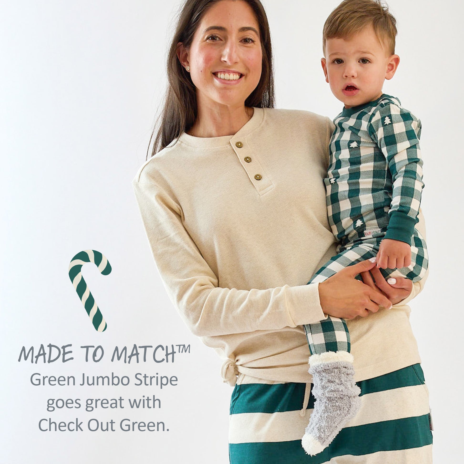 Woman holding a child wearing matching green and white striped outfits with text about color coordination.