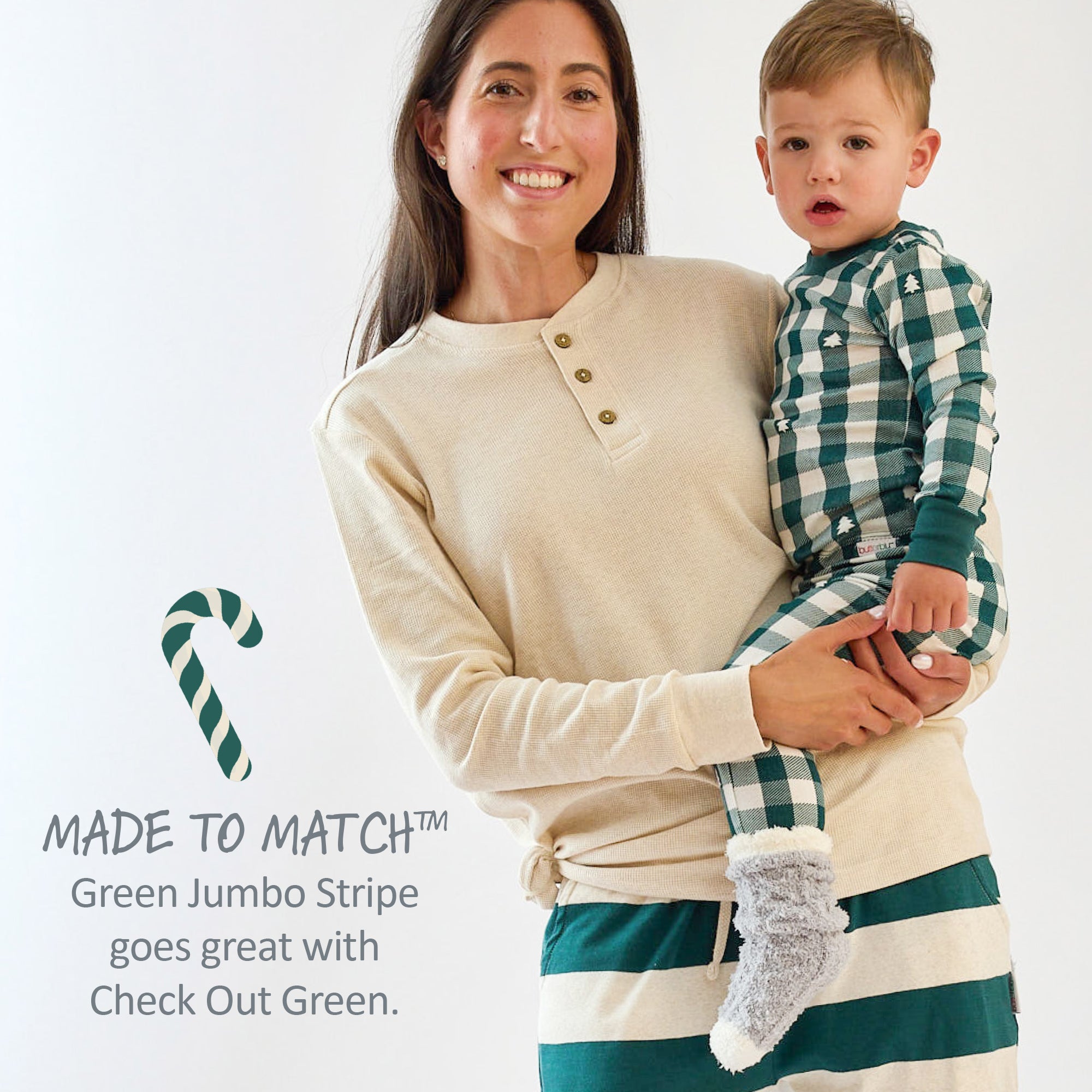 Woman holding a child wearing matching green and white striped outfits with text about color coordination.