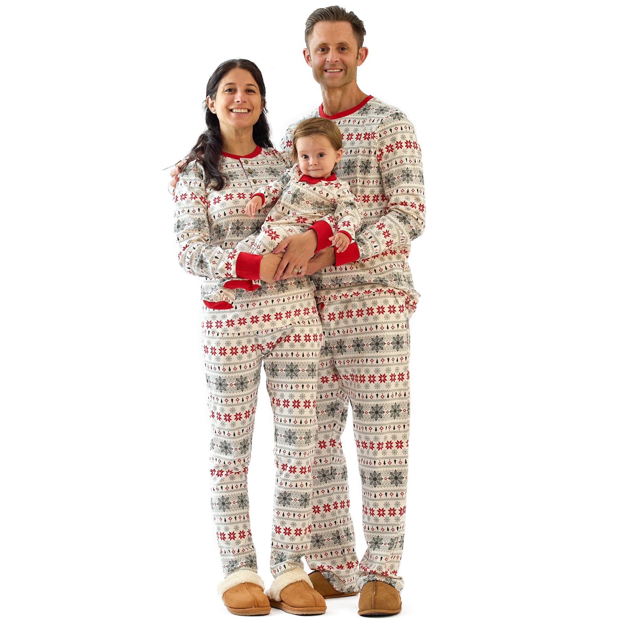 Family wearing matching festive pajamas on a white background