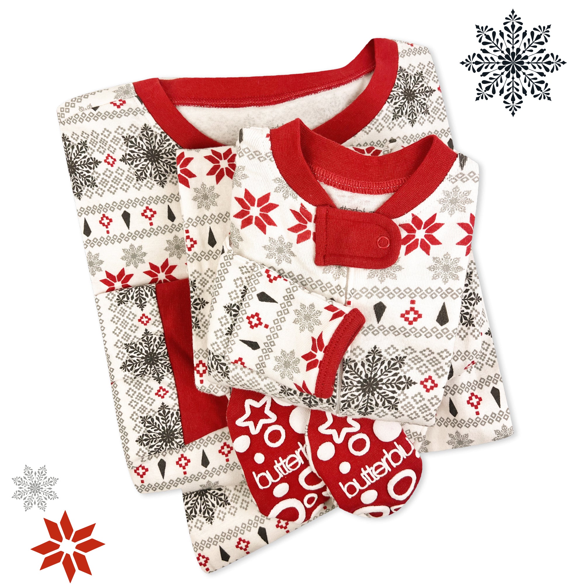 Baby pajama set with red and white patterns on a white background