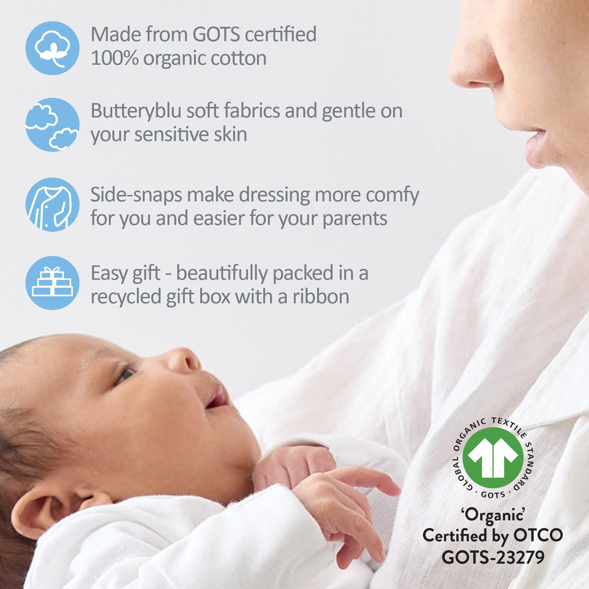 Baby wrapped in organic cotton fabric with a mother, featuring GOTS certification details.