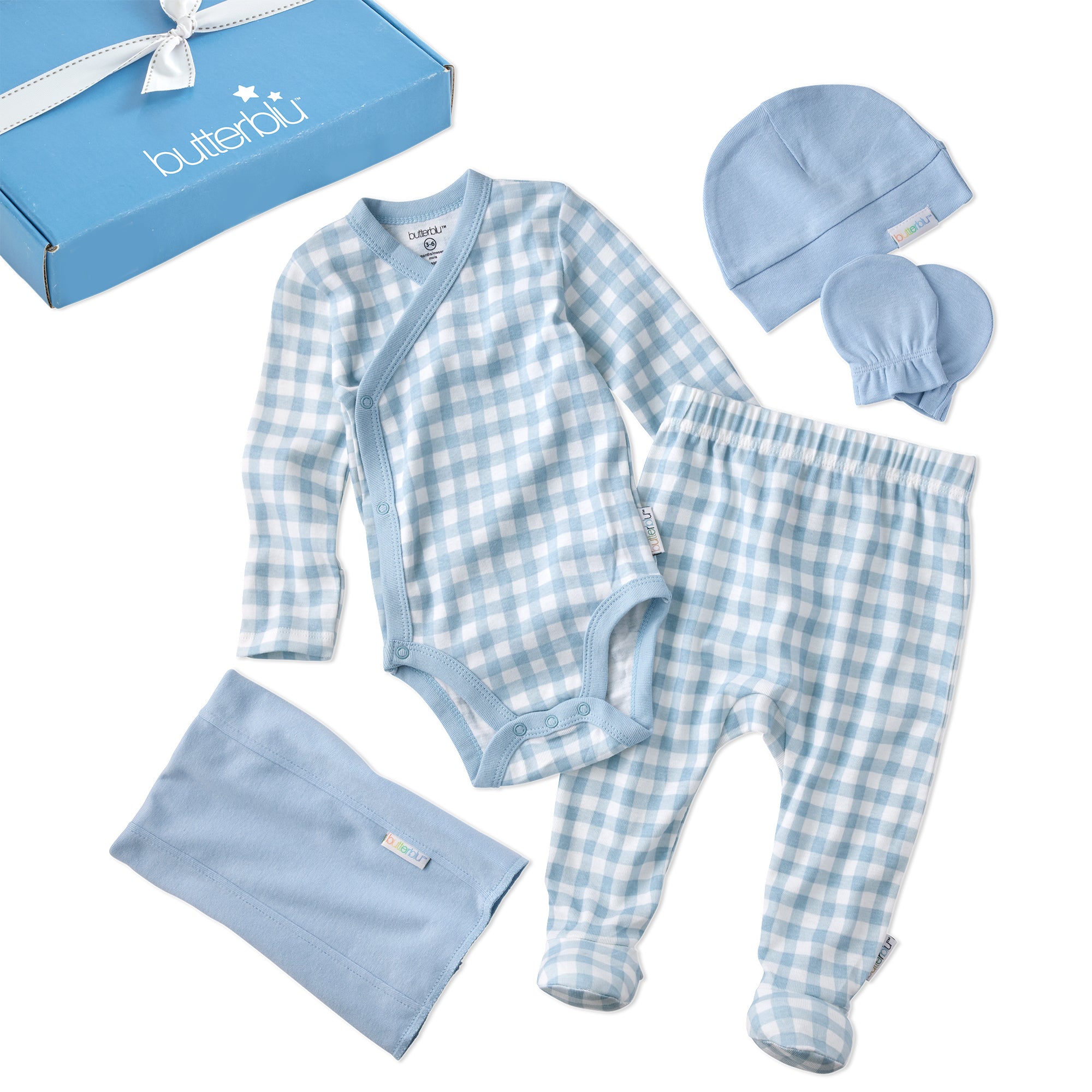 Baby clothing set with checkered pattern including onesie, pants, hat, and blanket on a white background.