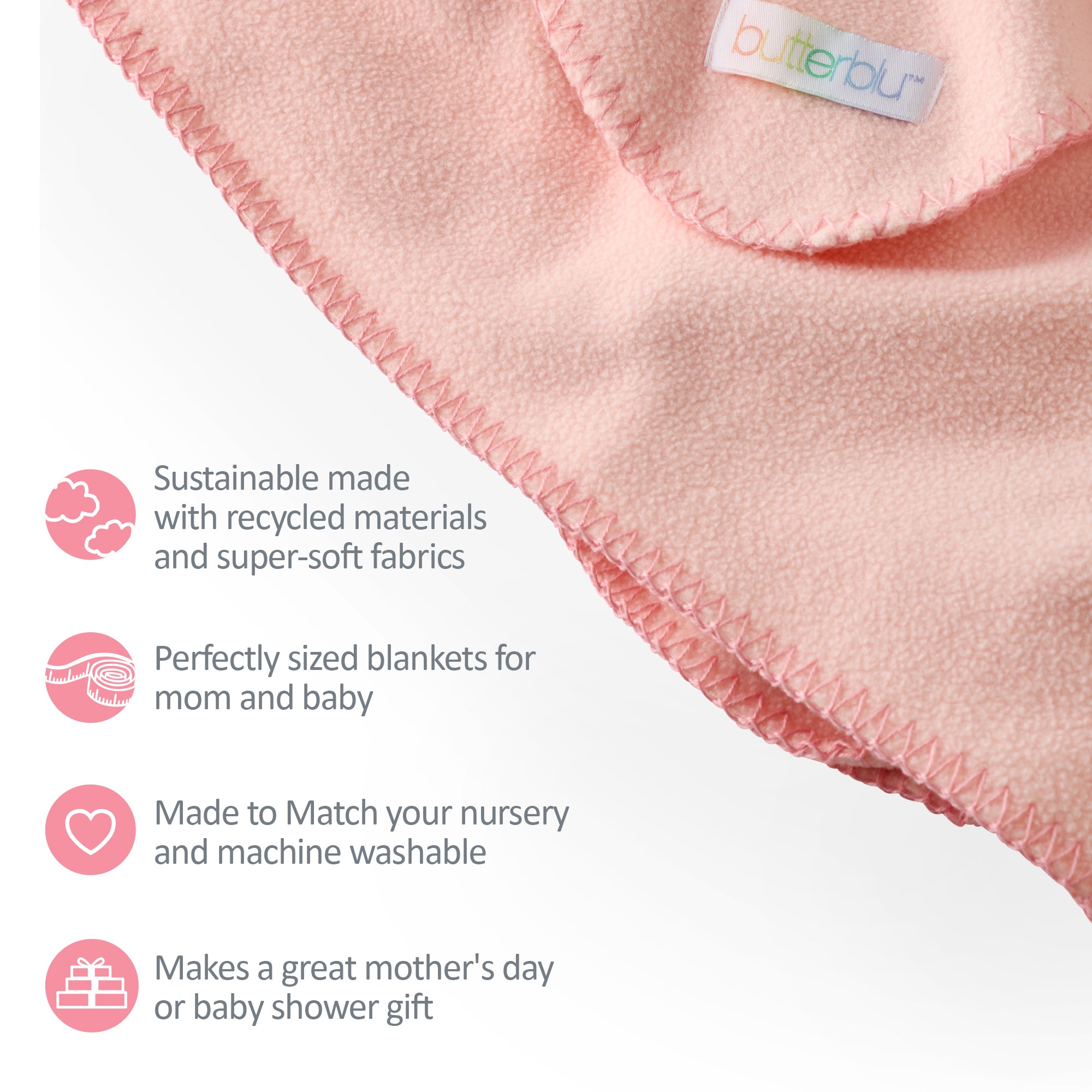 Pink blanket with recycled materials and super-soft fabrics, featuring a brand label.