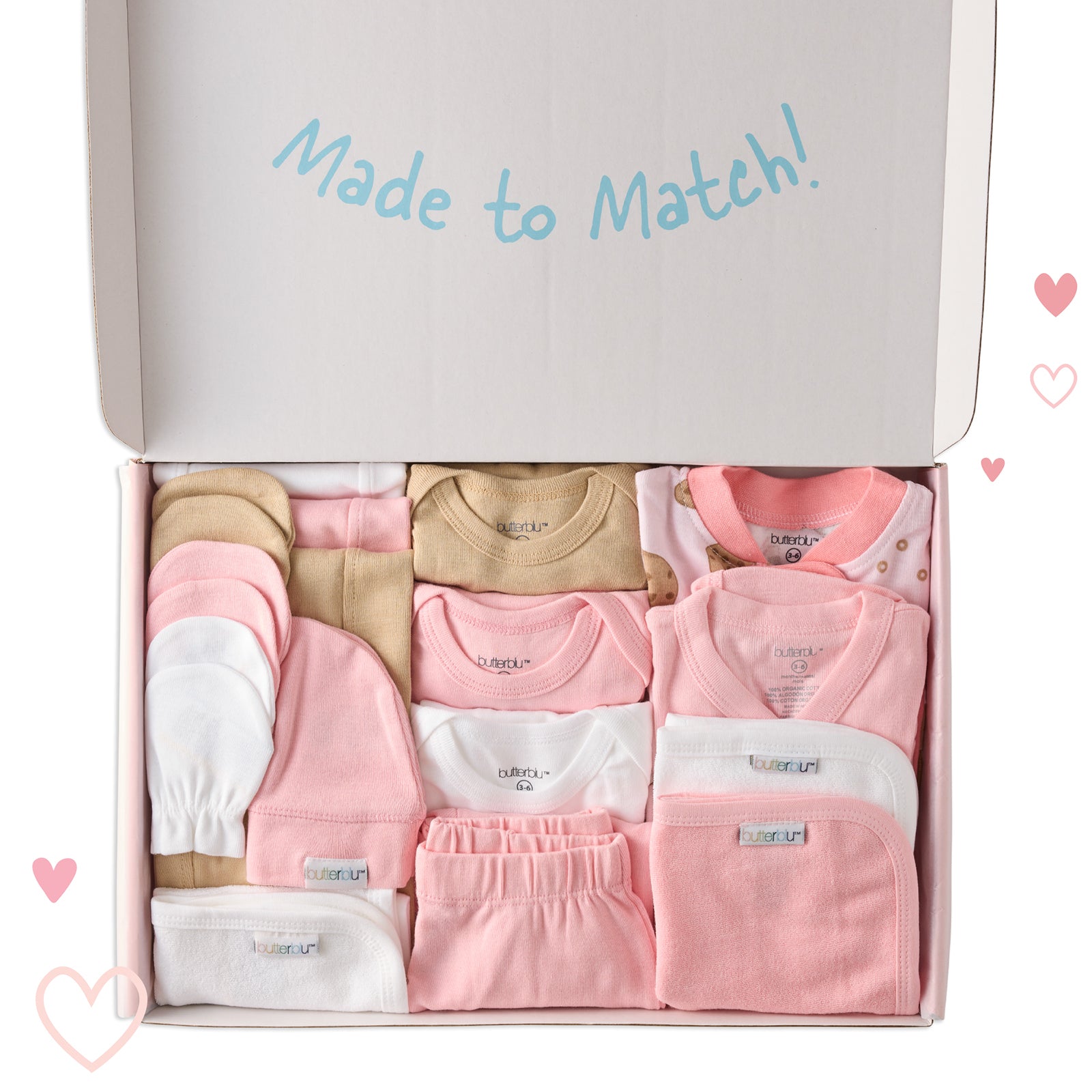 Box of baby clothes labeled 'Made to Match' with pink, beige, and white garments.