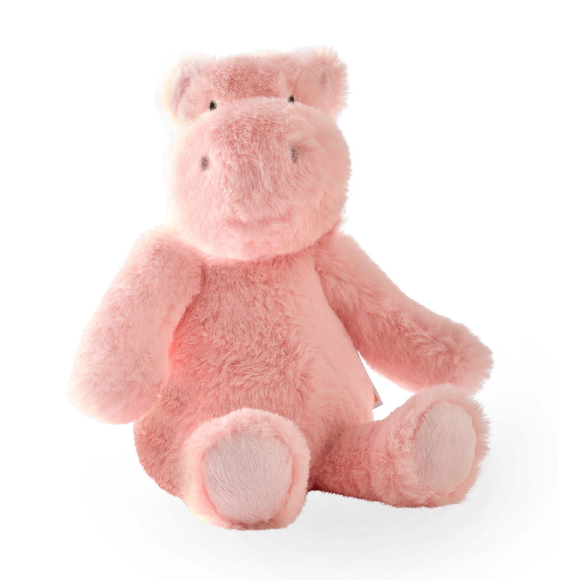 Pink plush hippo toy on a white background