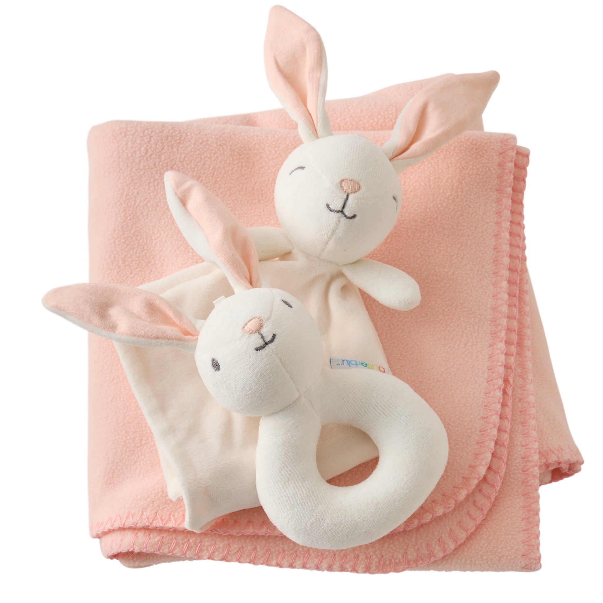 Pink blanket with white bunny plush toys on a white background