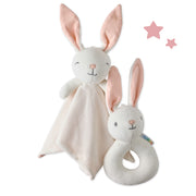 Two plush rabbit toys, one with a blanket and the other with a rattle, on a white background.