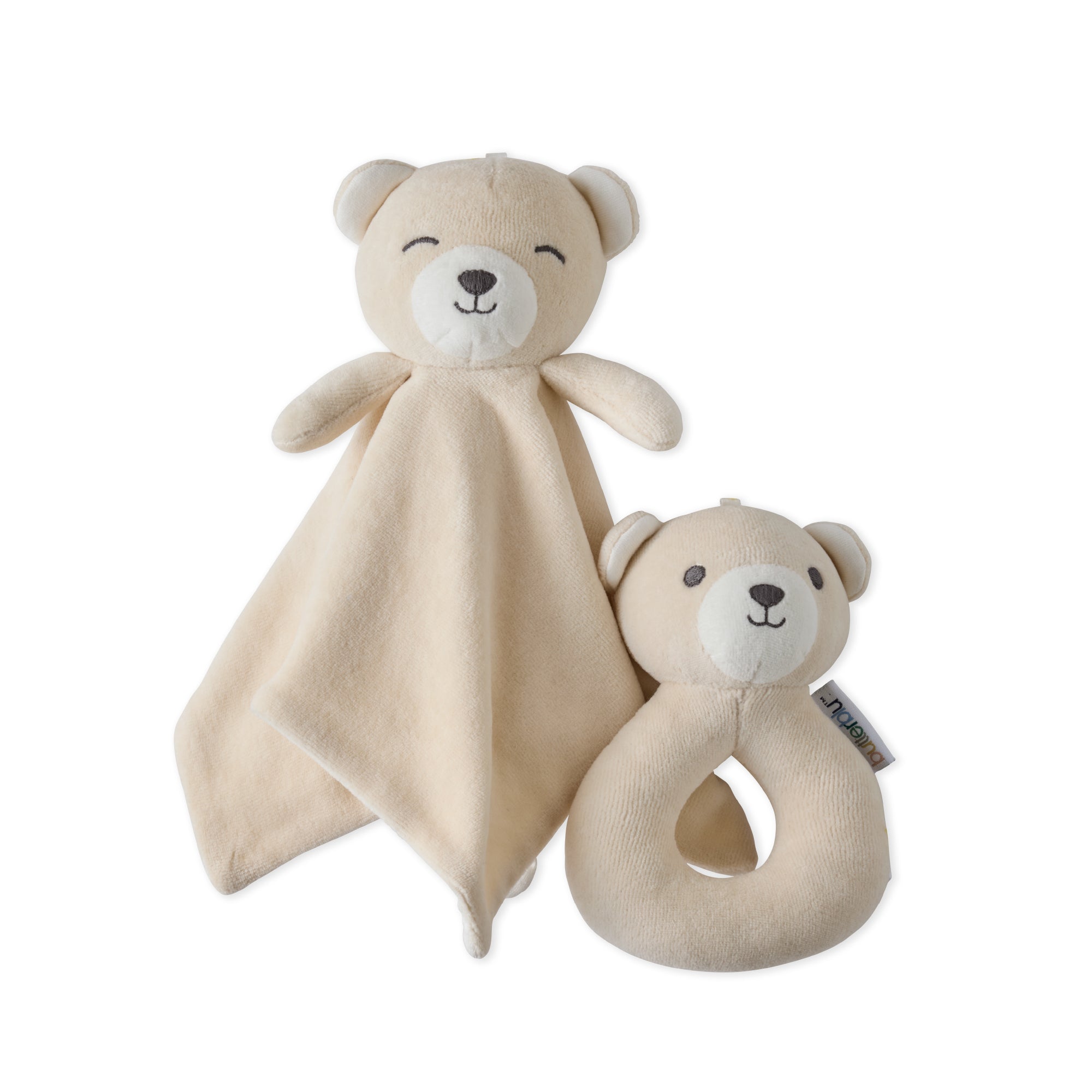 Two beige bear-shaped toys with a soft blanket and rattle on a white background