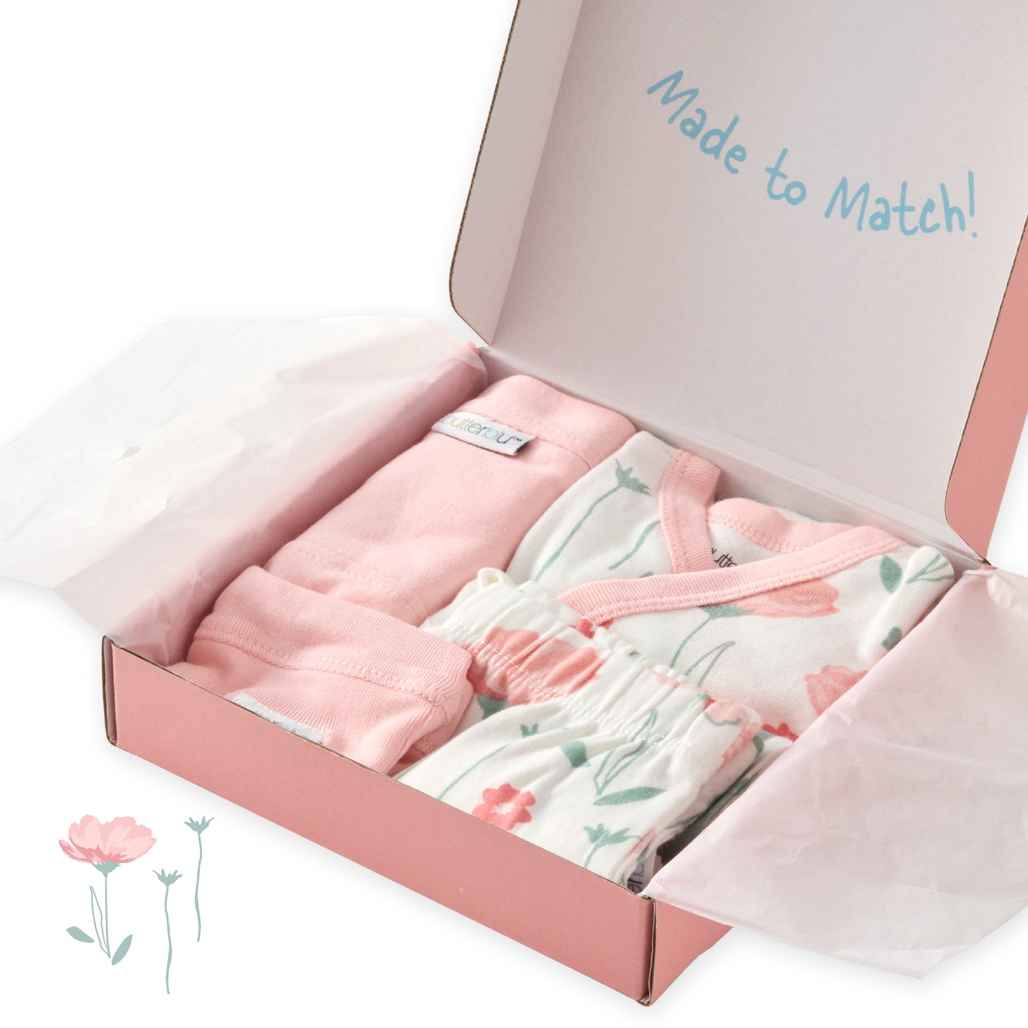 Baby clothing set in a pink box with floral design and text 'Made to Match'.