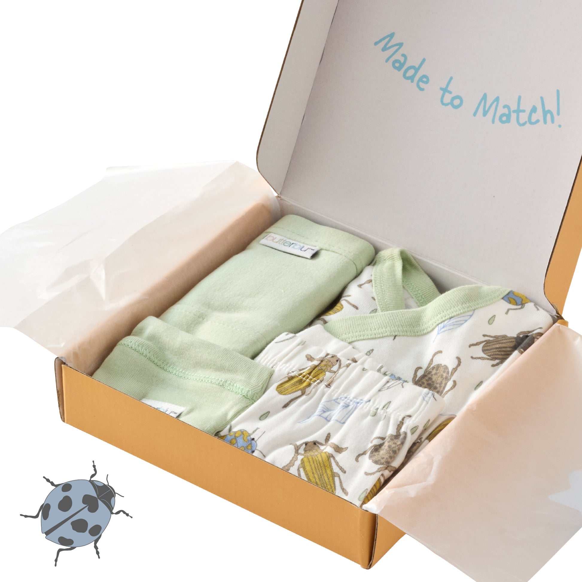 Open box containing baby clothing with text 'Made to Match!' on a white background.