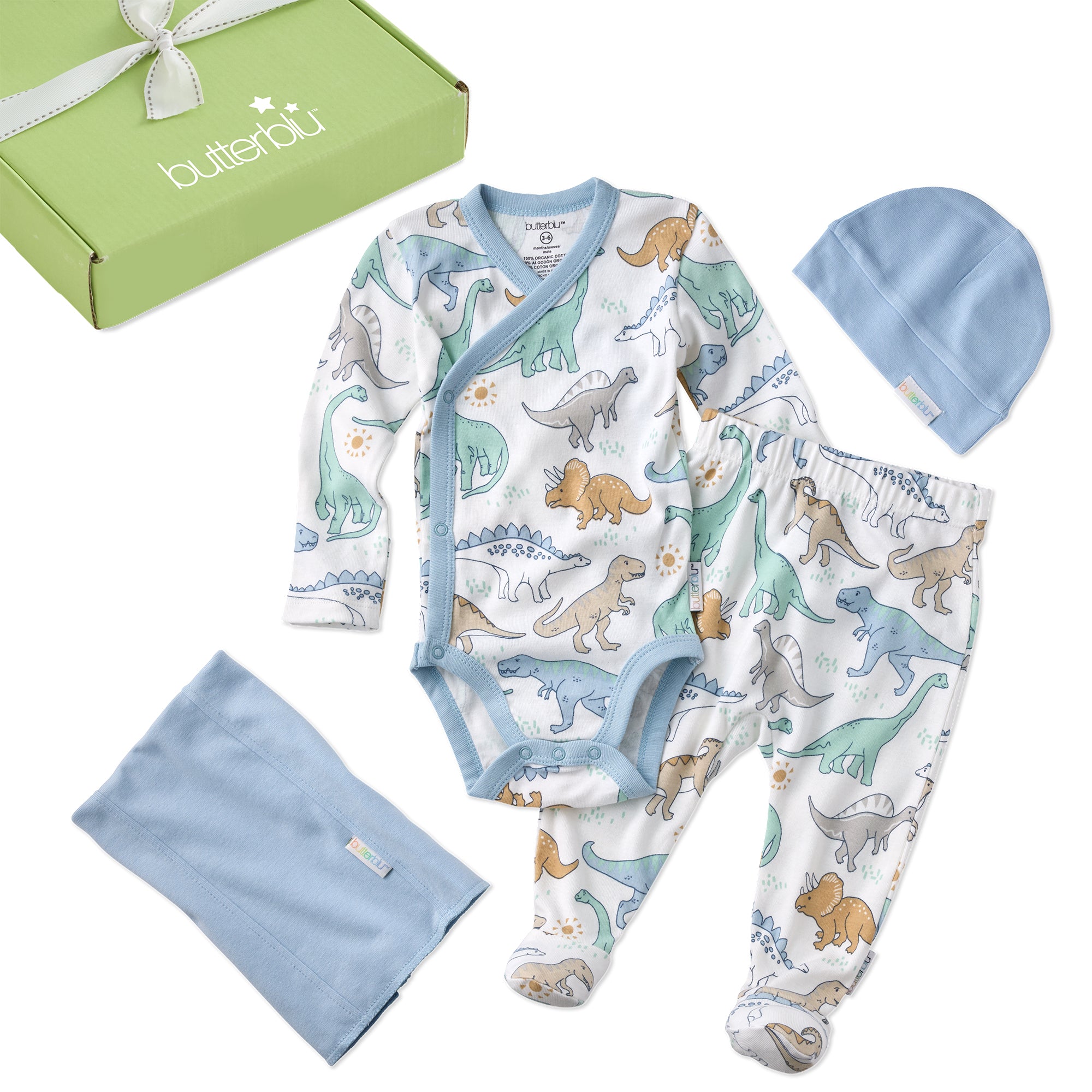 Baby clothing set with dinosaur pattern, including a onesie, pants, hat, and blanket, displayed in front of a green box with 'butterblu' branding.