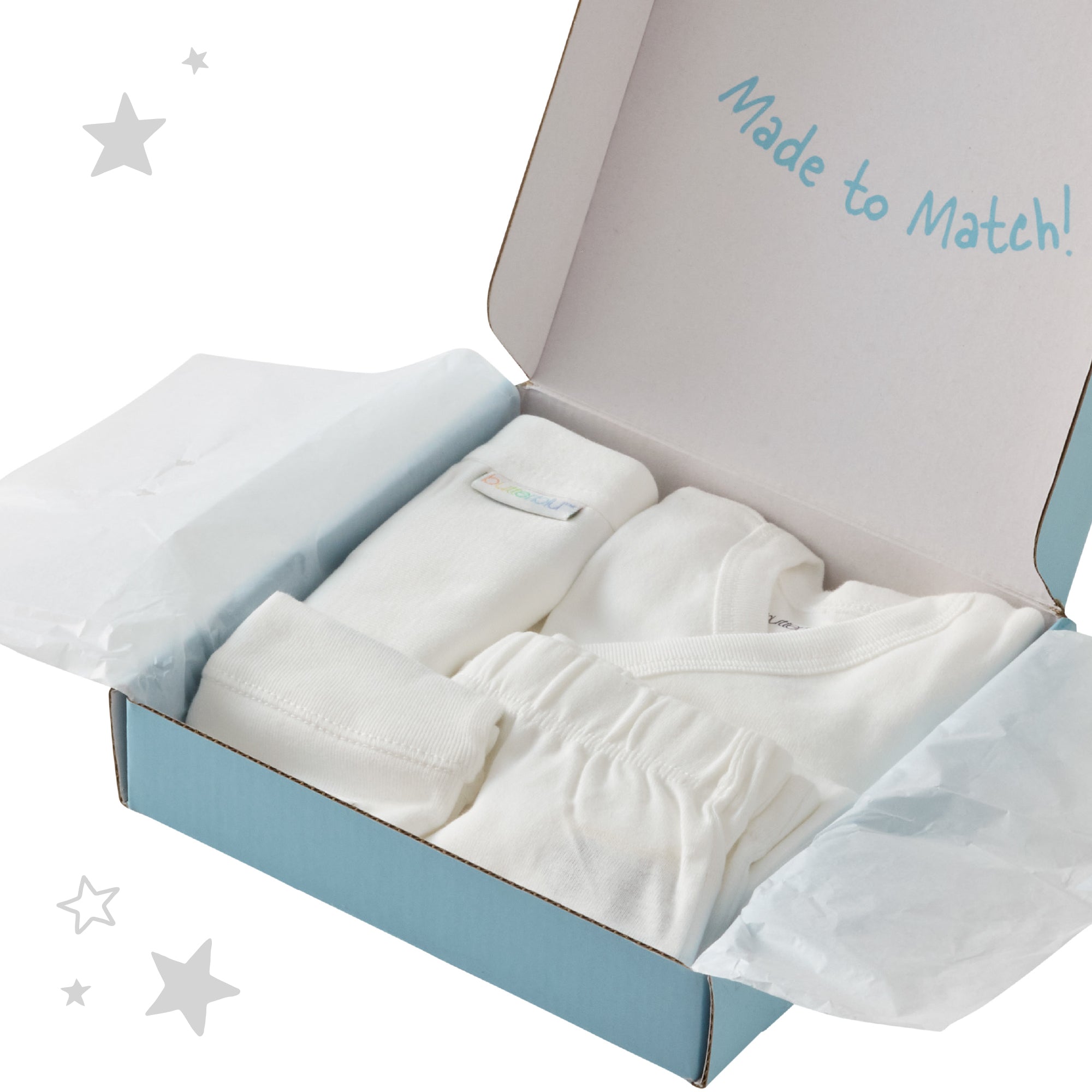 Open box containing white baby clothes with 'Made to Match!' text on a light gray background.