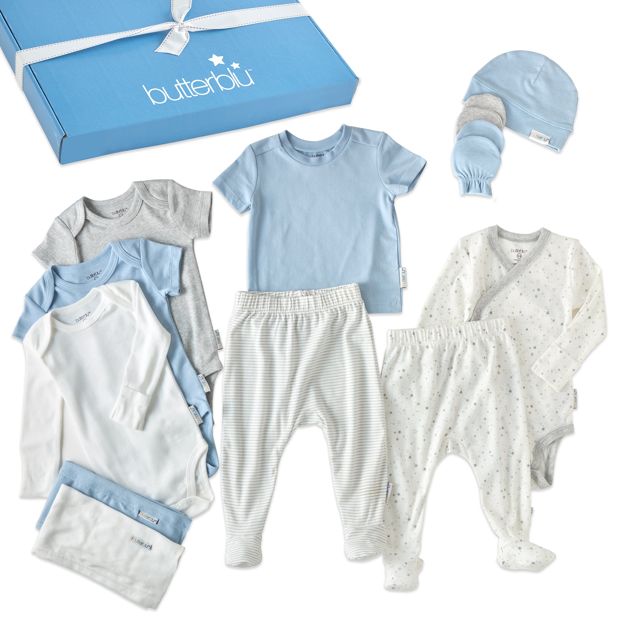 Collection of baby clothes including onesies, pants, and a hat with a 'butterblu' box in the background.