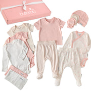Collection of baby clothes including shirts, pants, and a hat on a white background with 'butterblu' branding.