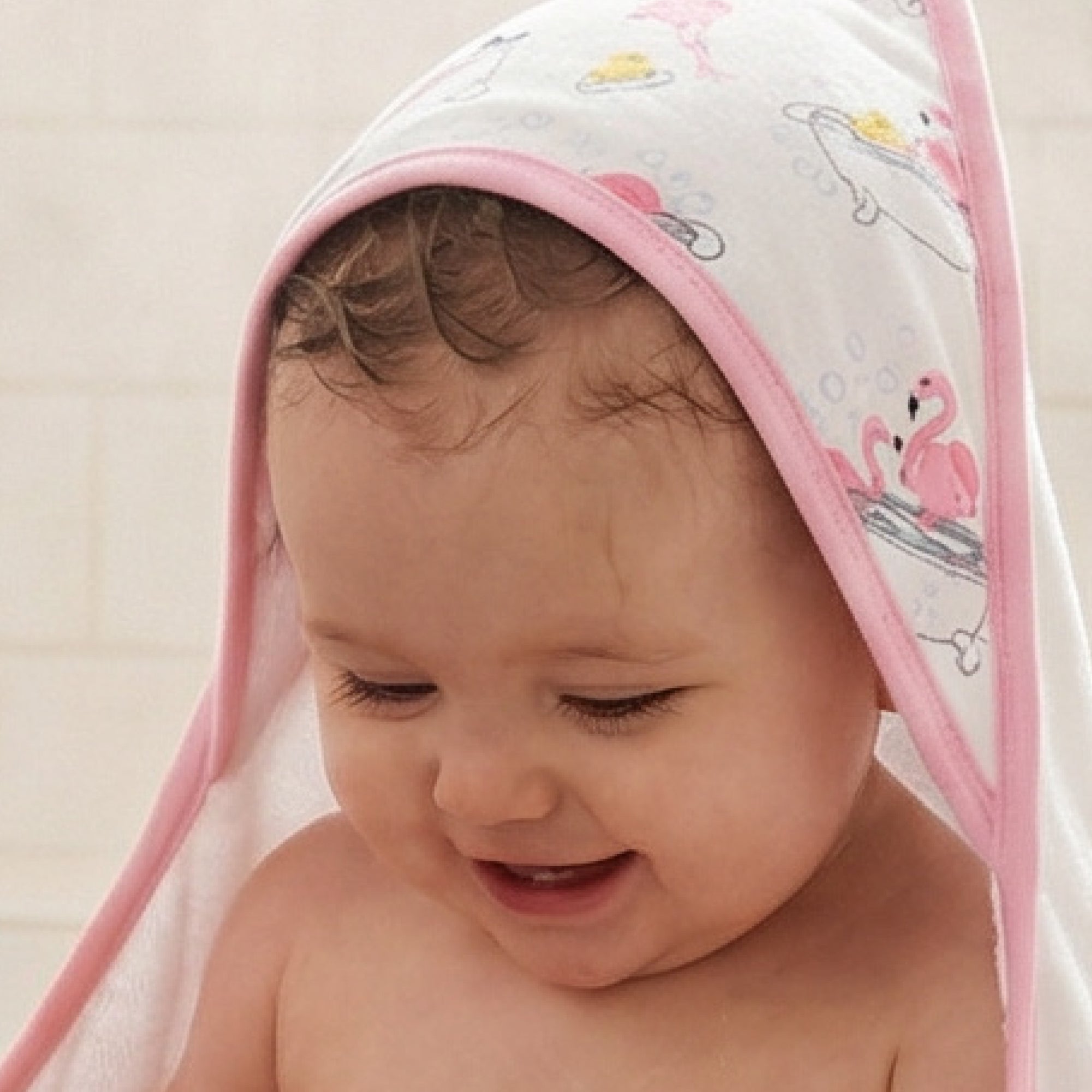 Baby wearing hooded towel