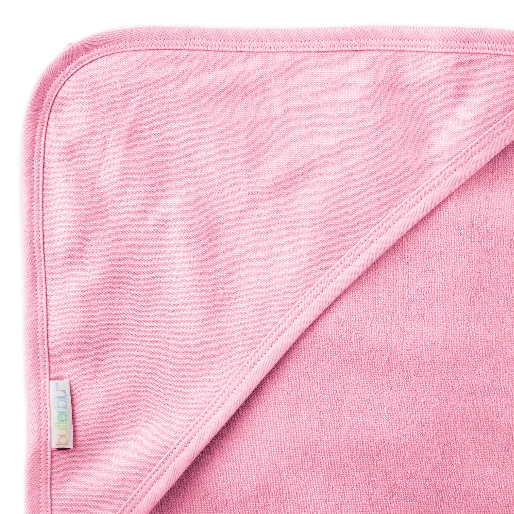 Close up of hood on towel with butterblu tag on towel