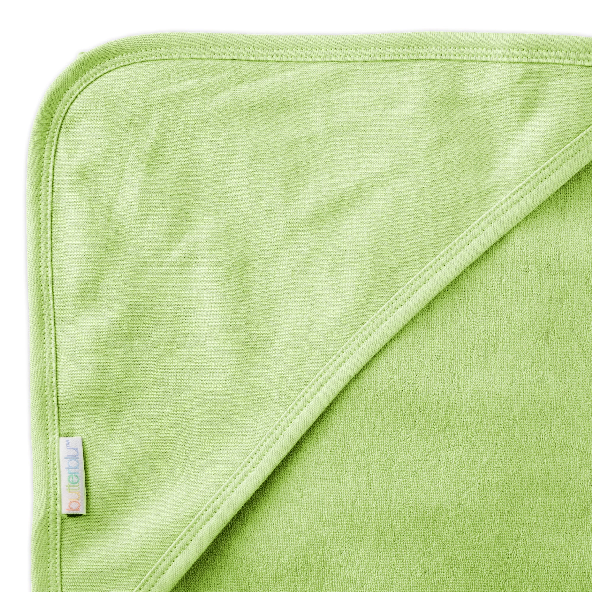 Close up of hood on towel with butterblu tag on towel
