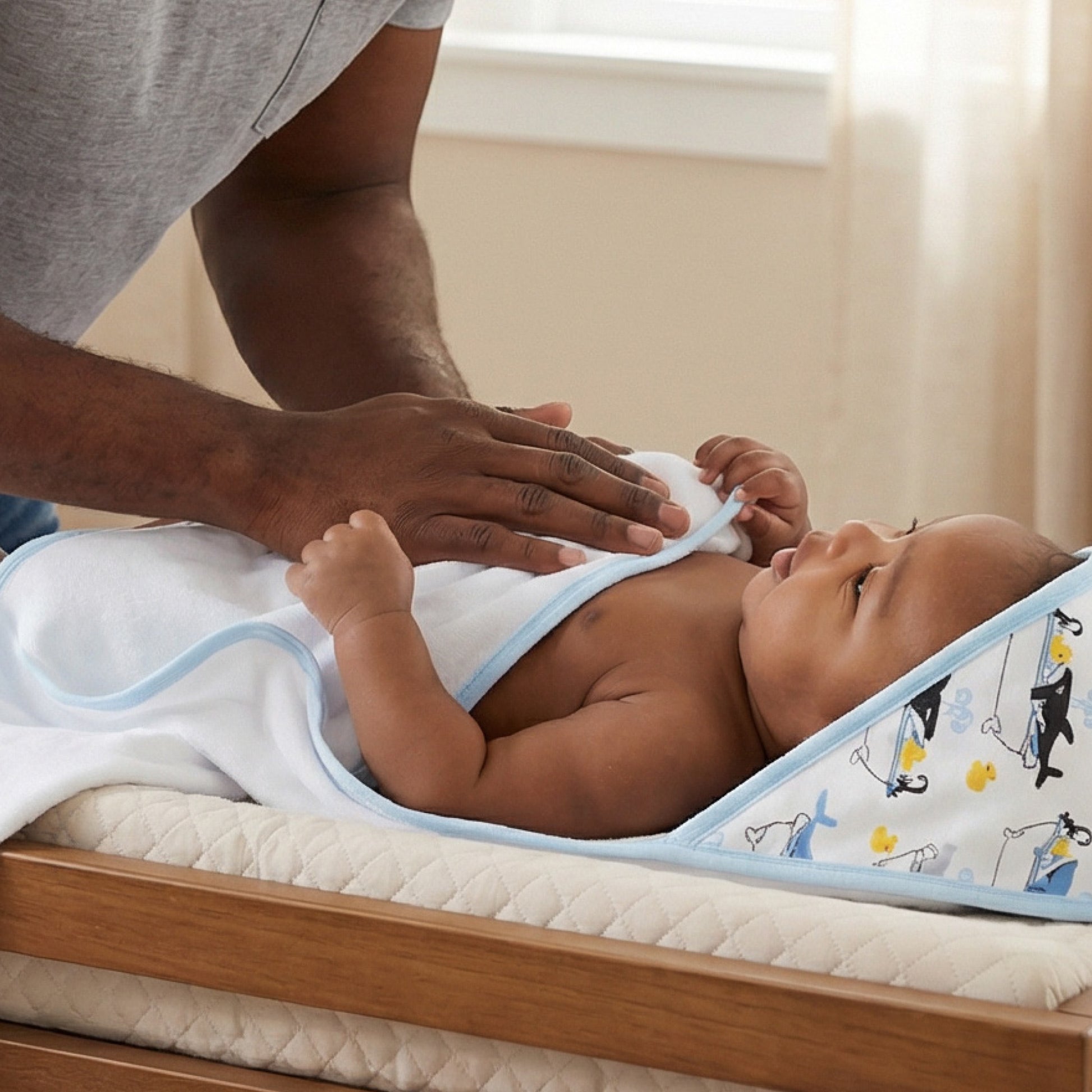 Baby wearing hooded towel