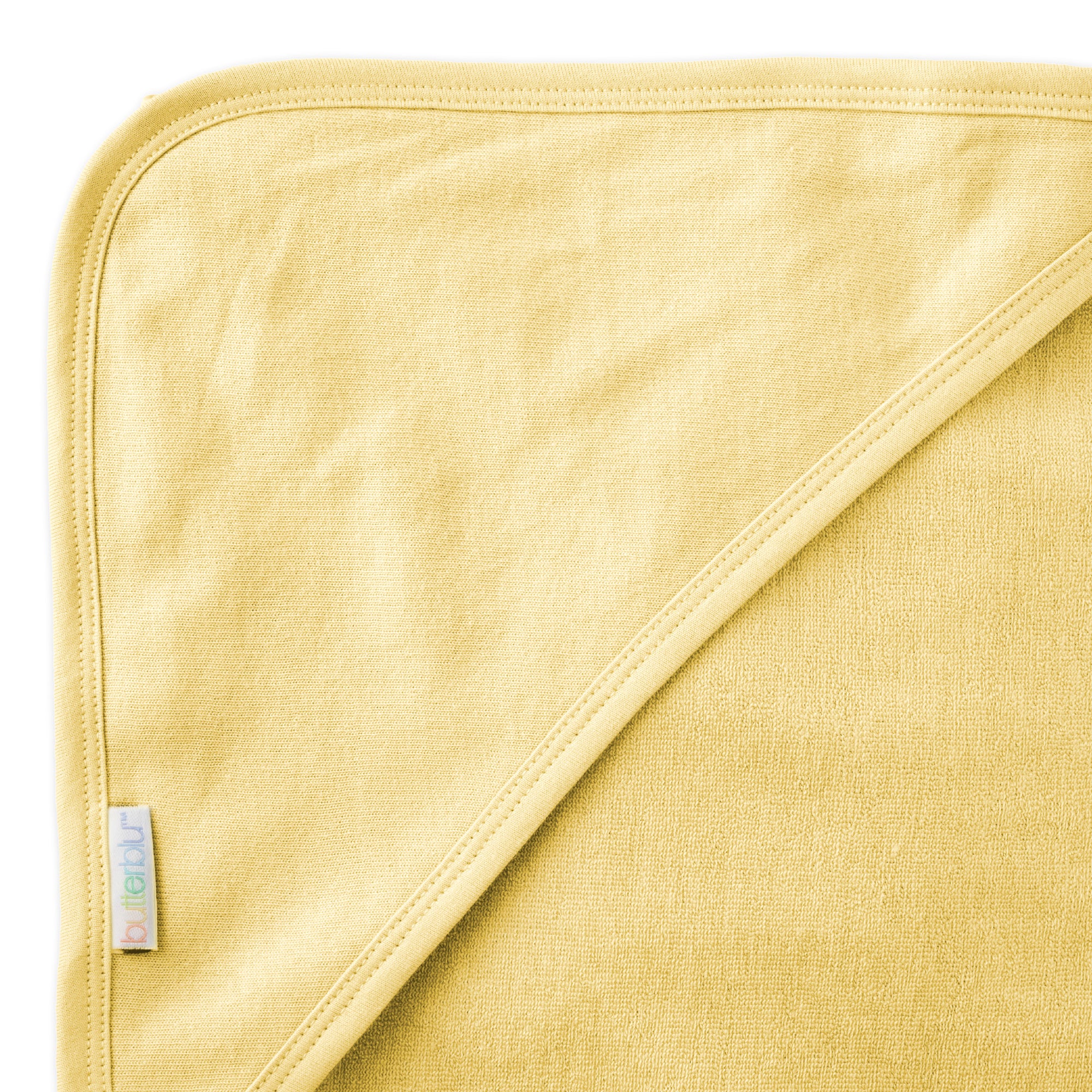 Close up of hood on towel with butterblu tag on towel