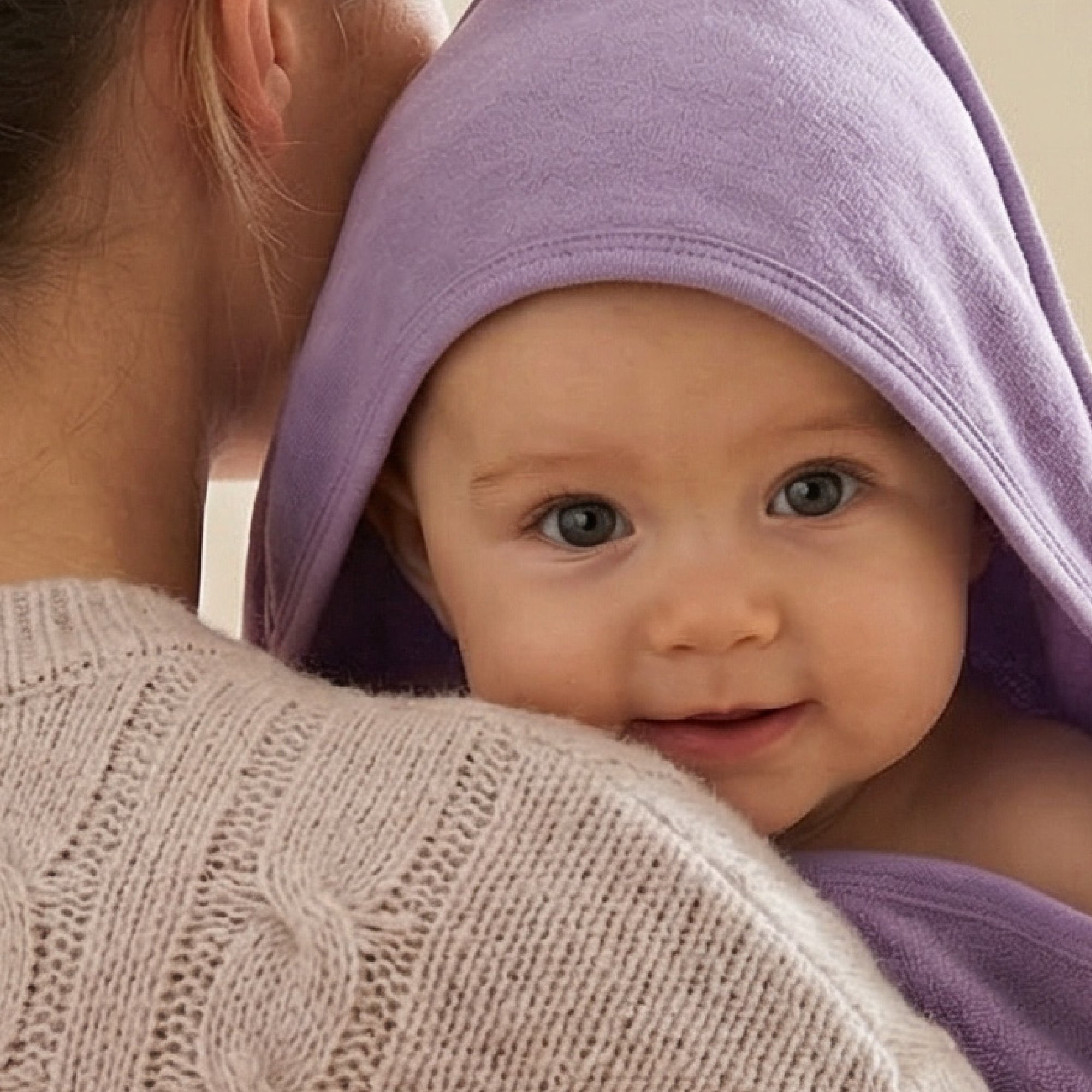 Baby wearing hooded towel