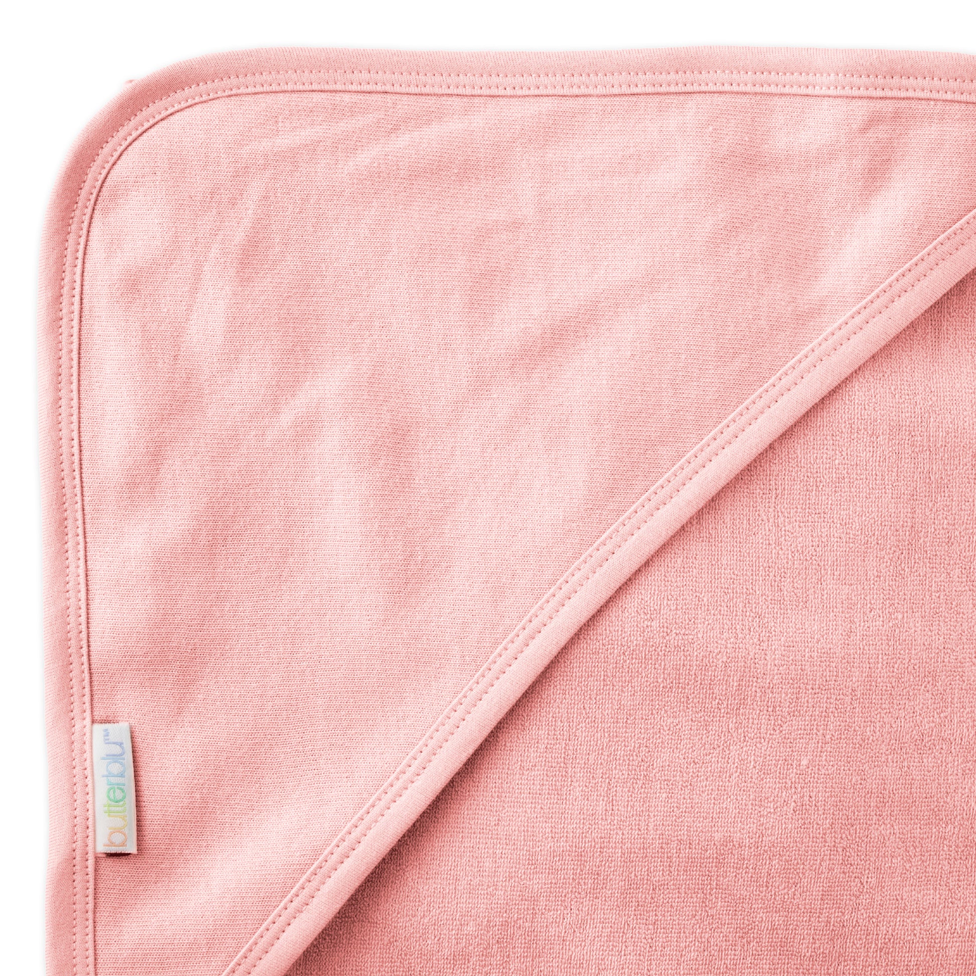 Close up of hood on towel with butterblu tag on towel