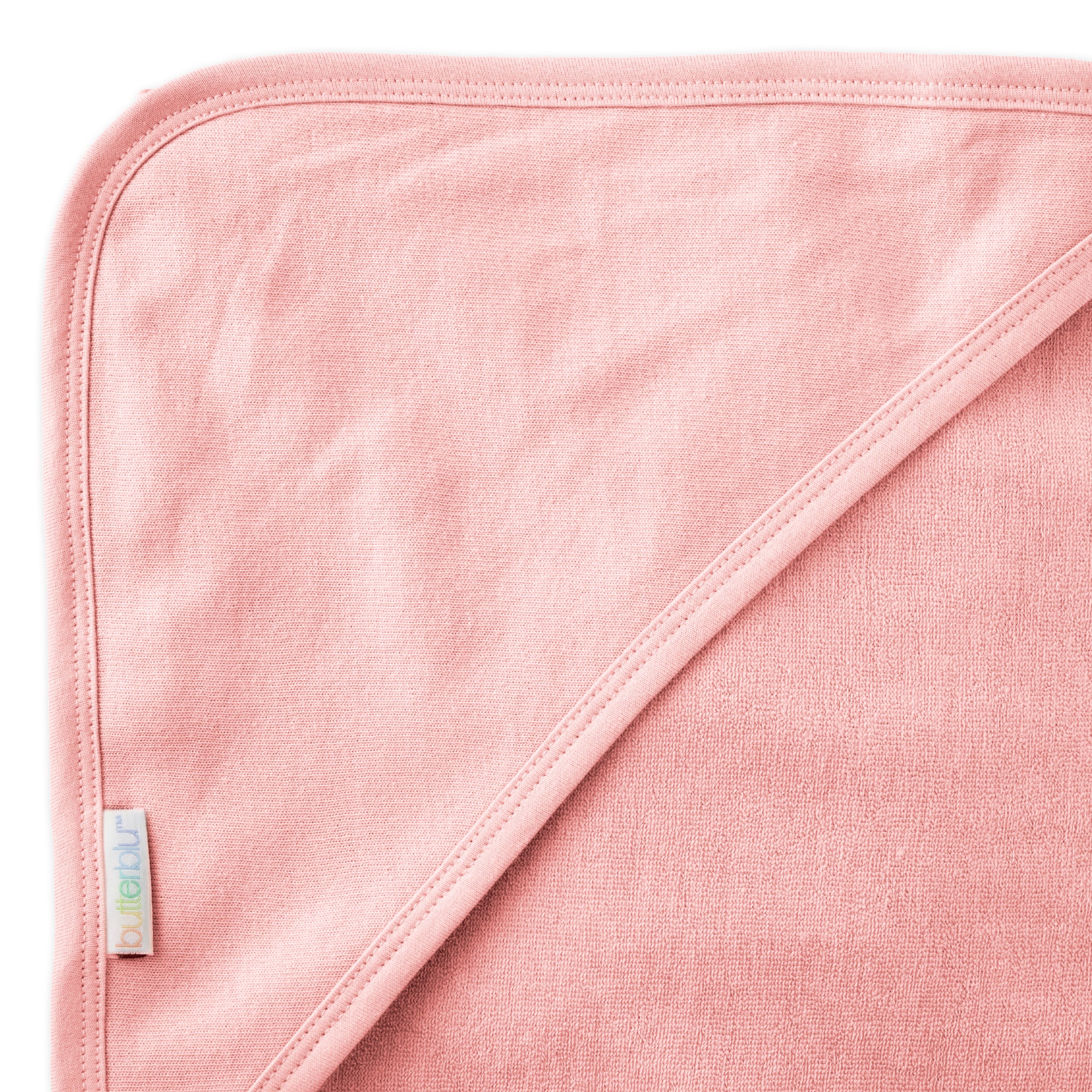 Close up of hood on towel with butterblu tag on towel