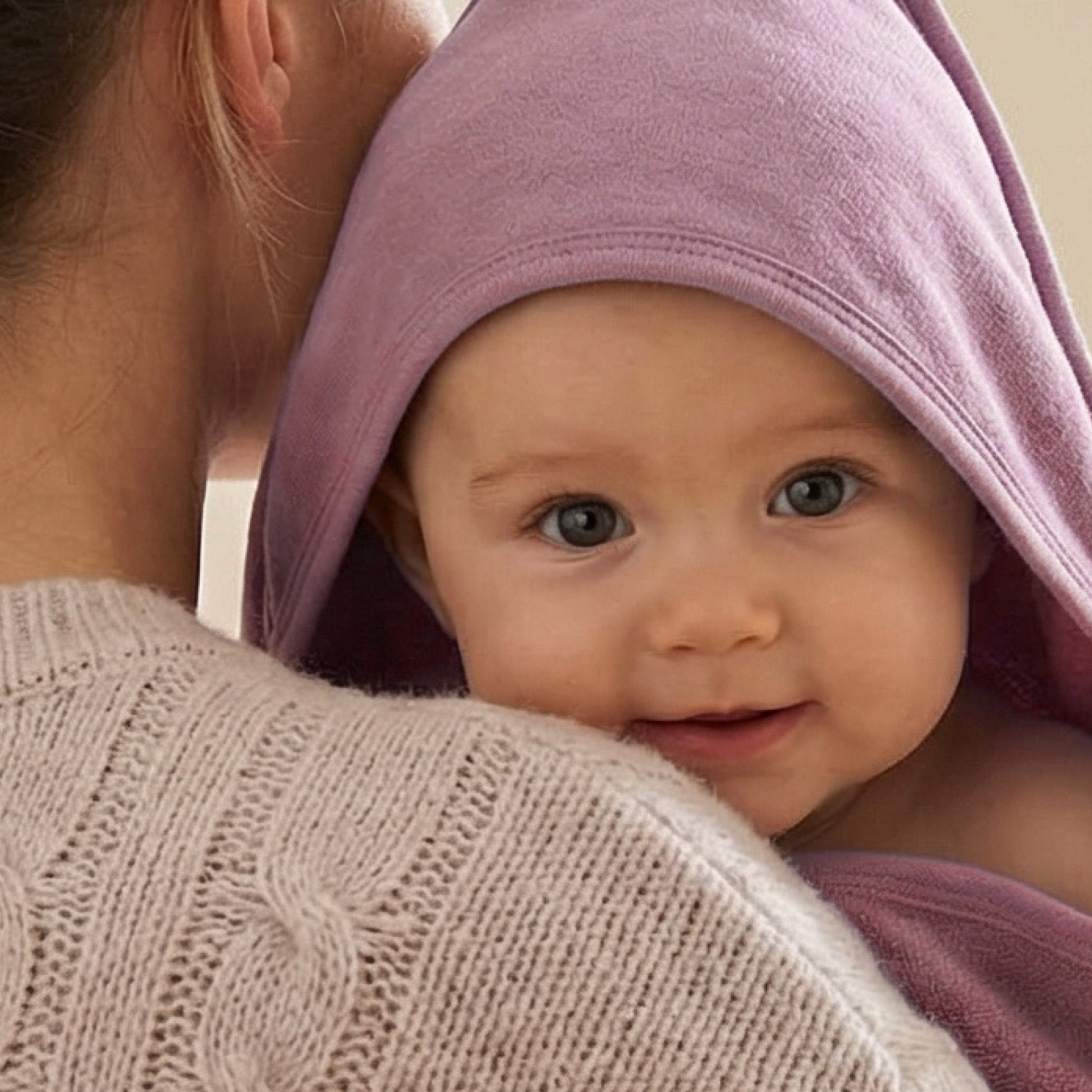 Baby wearing hooded towel