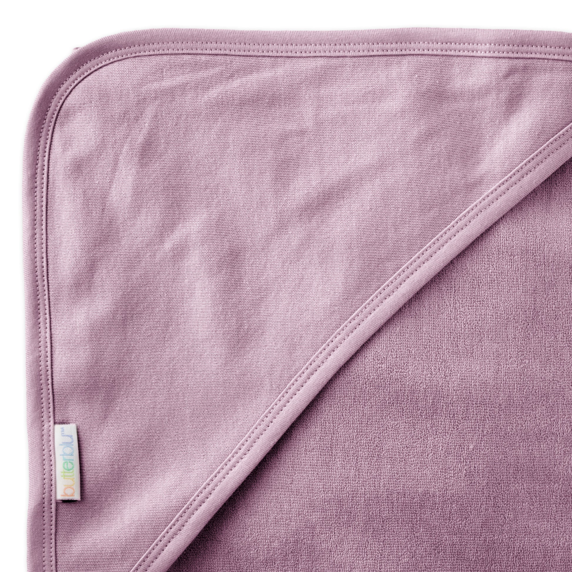 Close up of hood on towel with butterblu tag on towel